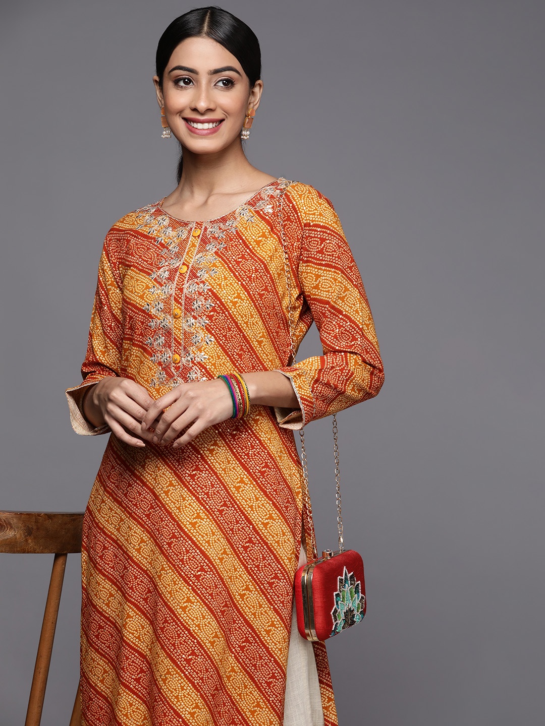 

Varanga Women Mustard Yellow & Rust Bandhani Embroidered Gotta Patti Indie Prints Kurta