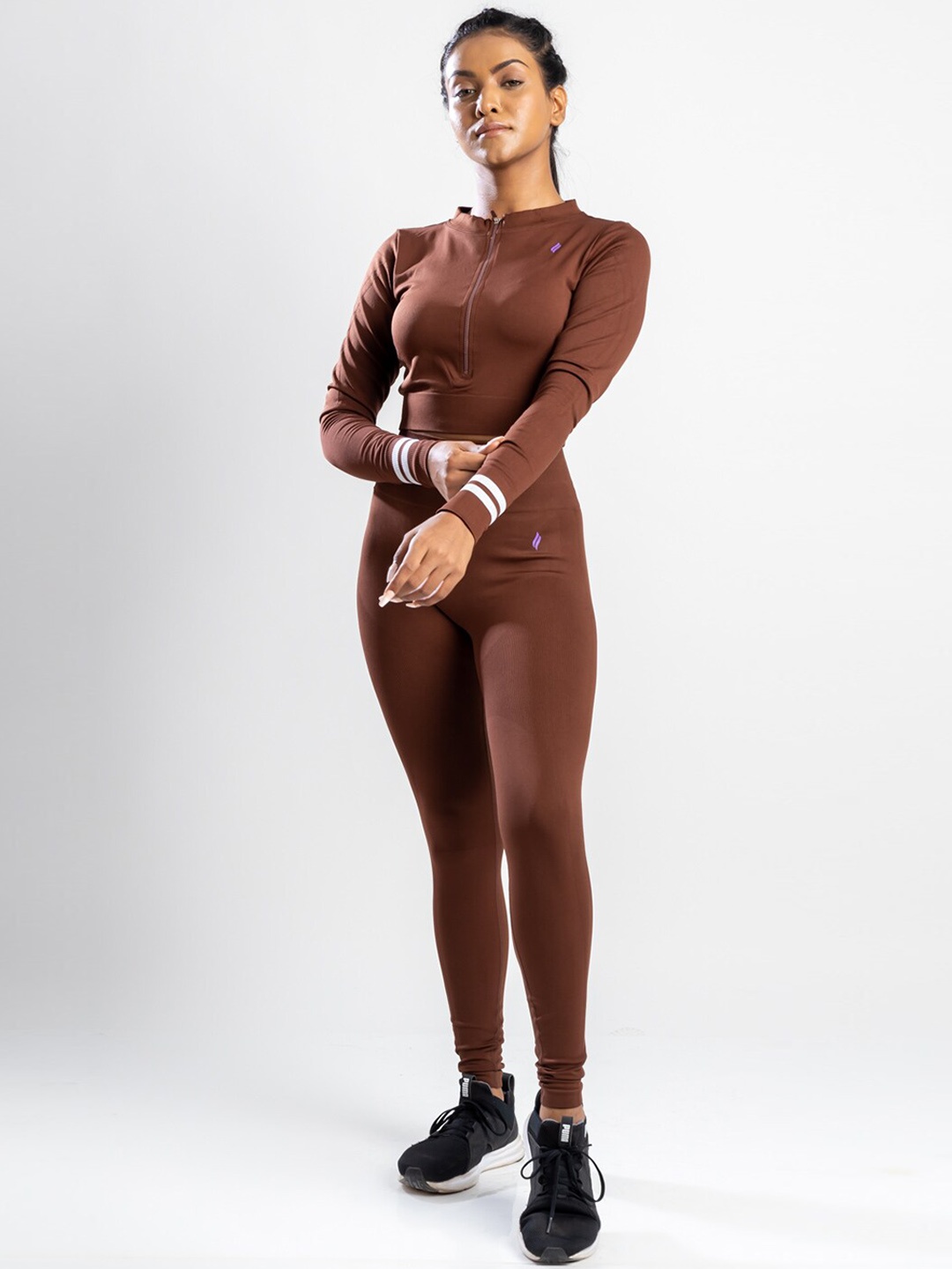 

SKNZ Women Brown Solid Tracksuits