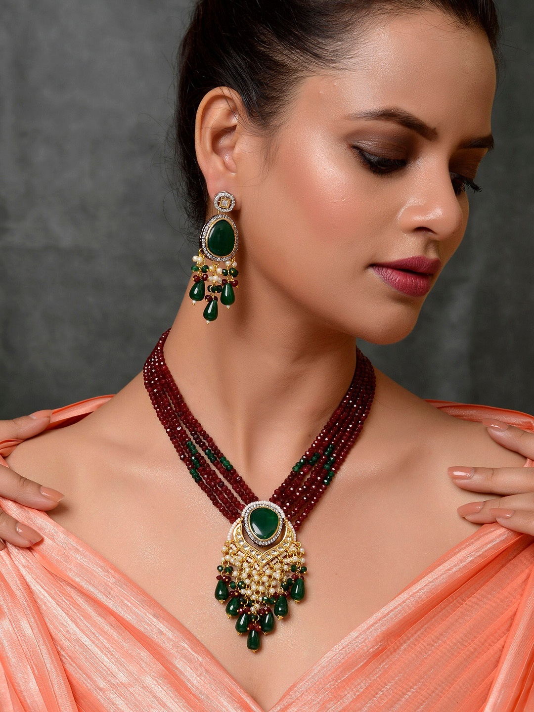 

DASTOOR Gold-Plated Red & Green Stone Studded & Beaded Handcrafted Jewellery Set