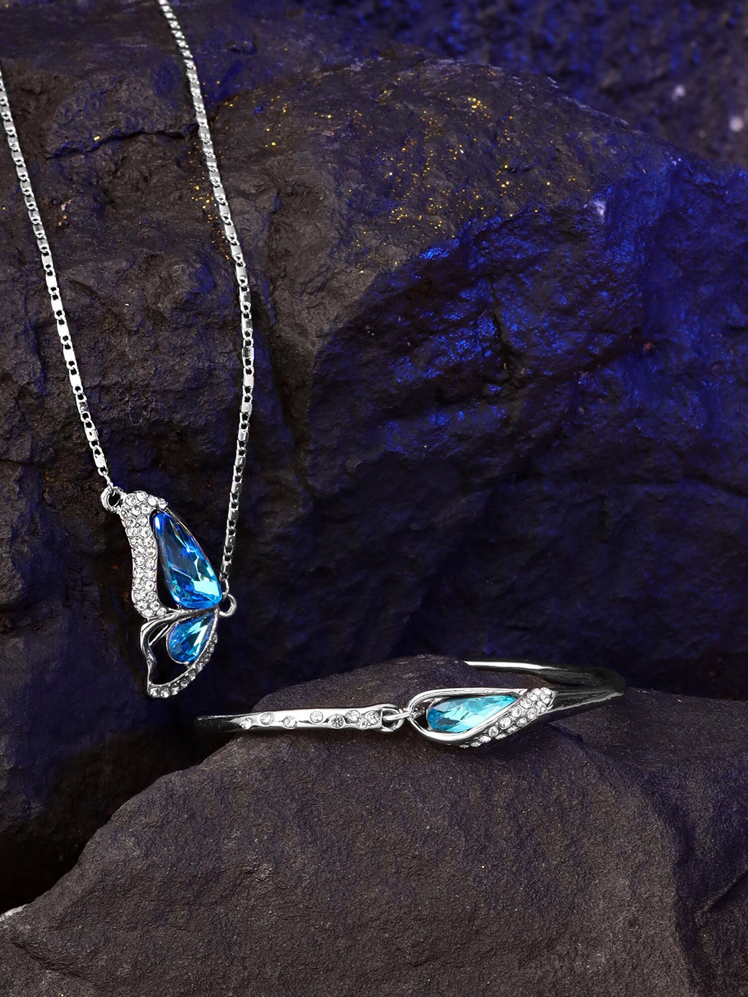 

Yellow Chimes Set of Silver toned butterfly designed pendant and bracelet