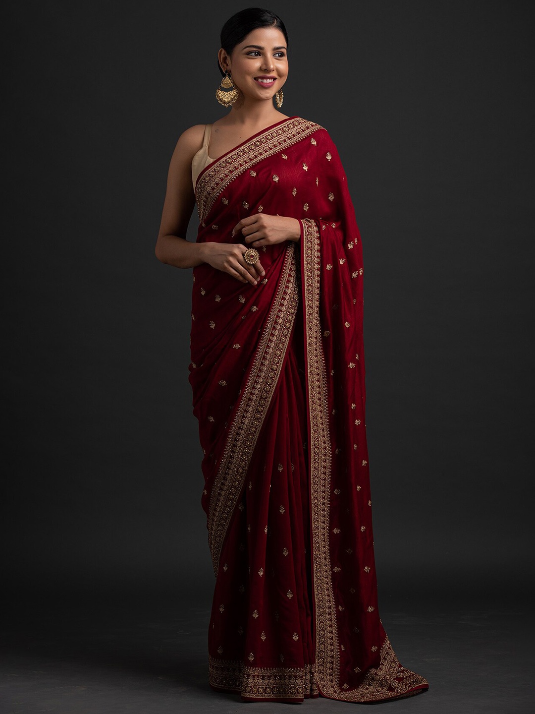 

Koskii Maroon & Gold-Toned Floral Embroidered Art Silk Saree