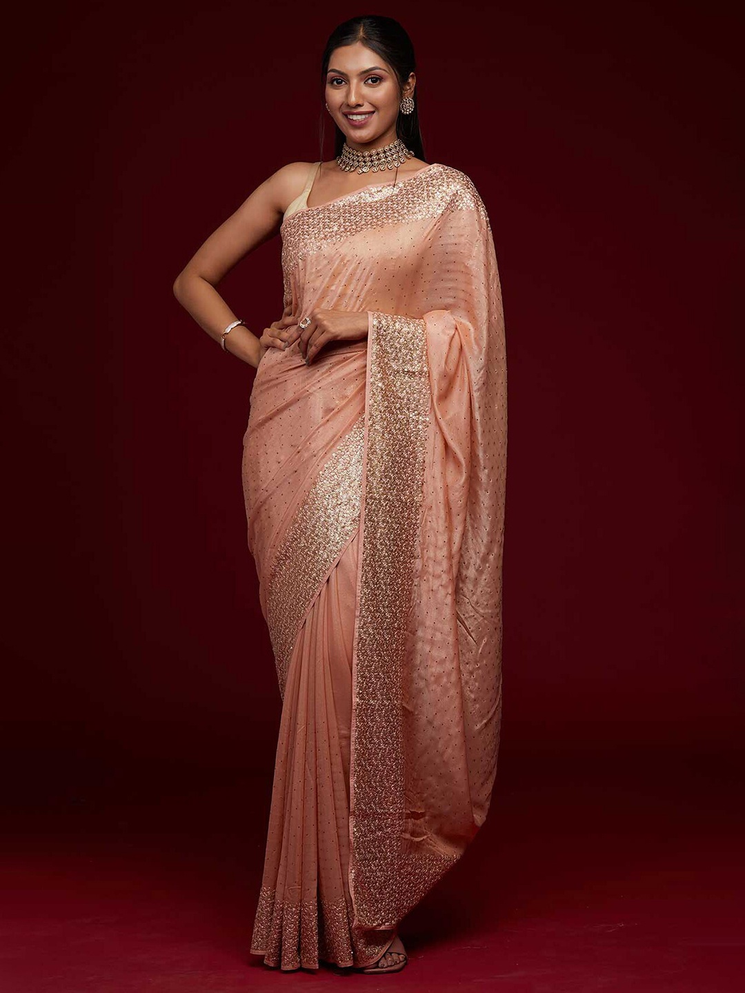 

Koskii Peach-Coloured Embellished Sequinned Saree