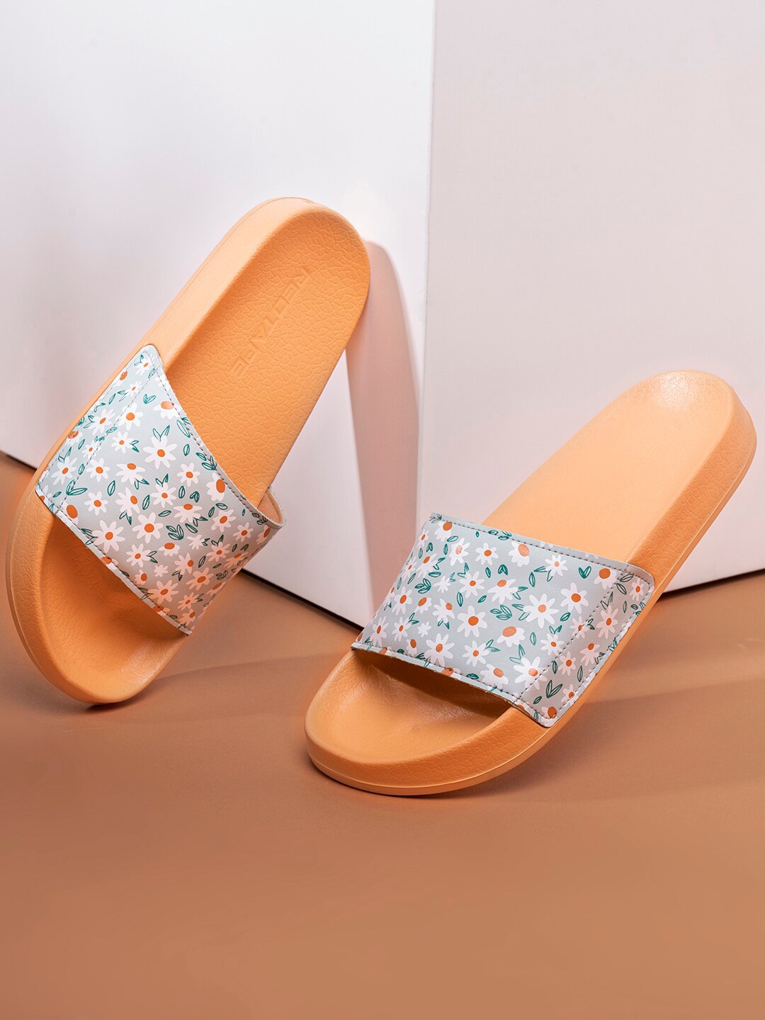 

Red Tape Women Orange & Blue Printed Floral Rubber Sliders