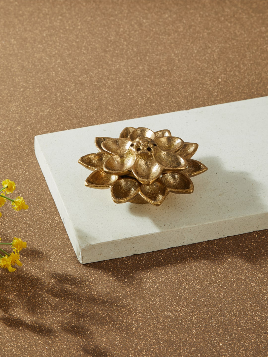 

Fabindia Gold-Toned Textured Lotus Designed Incense Stick Holder
