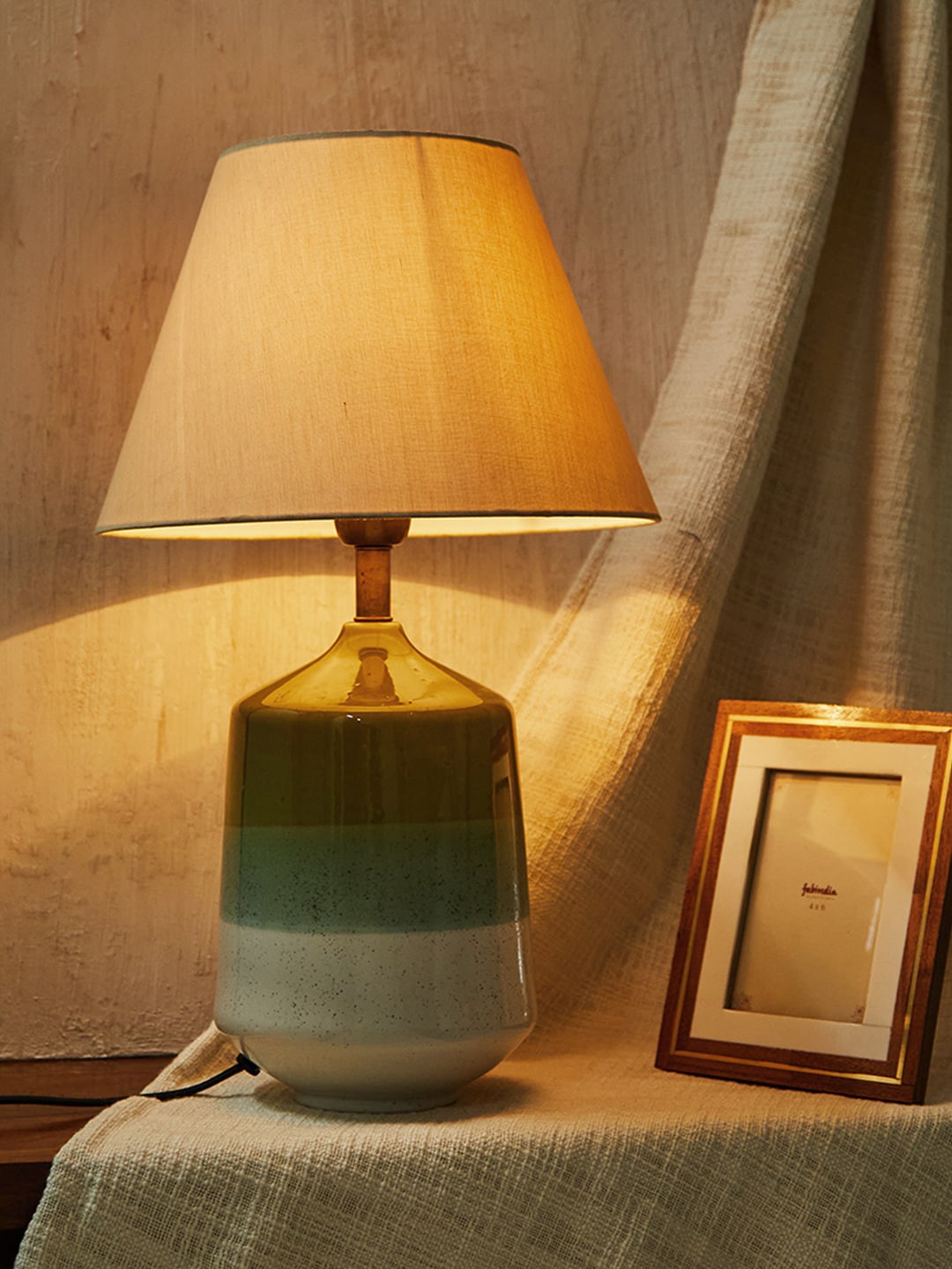 

Fabindia Green Solid Frustum Ceramic Table Lamp