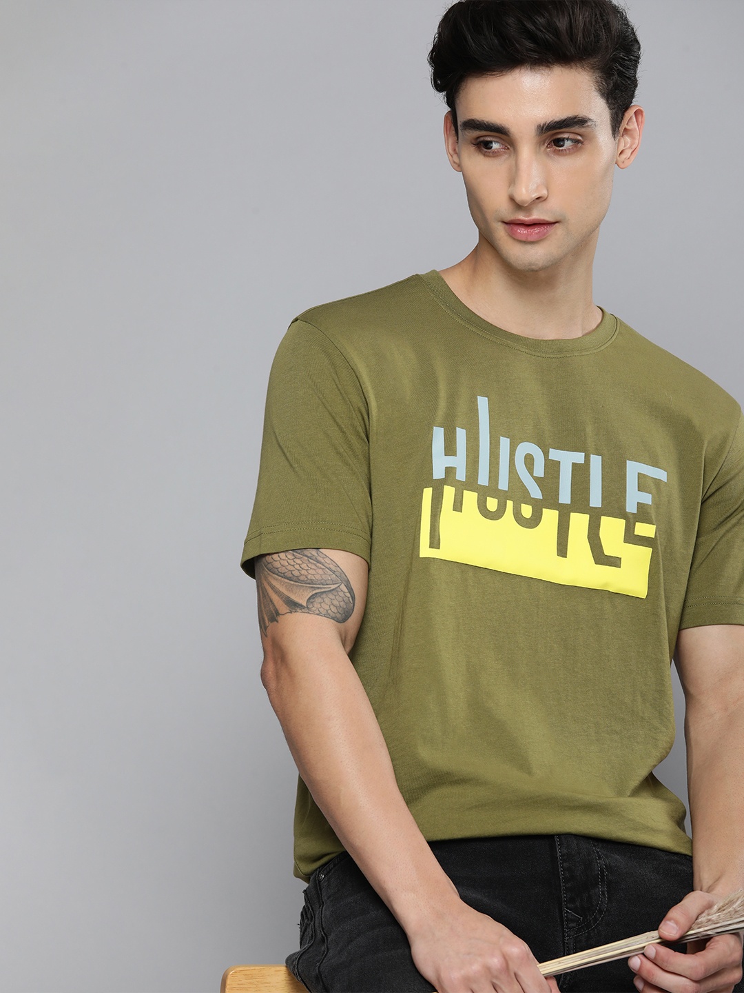 

HERE&NOW Men Olive Green & Yellow Typography Printed Pure Cotton T-shirt