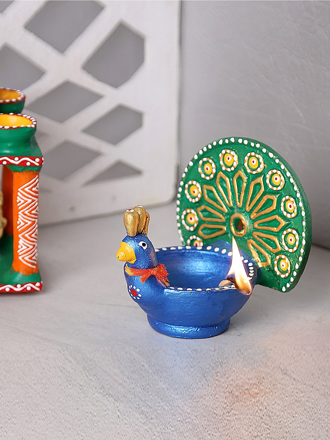 

Aapno Rajasthan Blue Peacock Design Terracotta Diya
