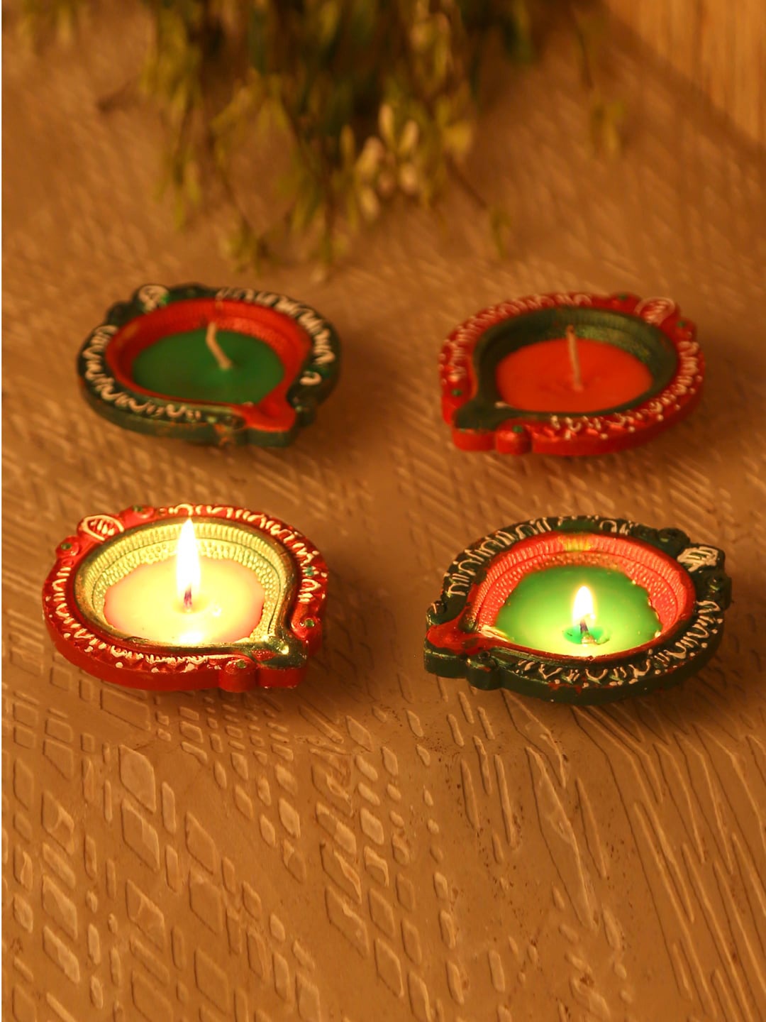 

Aapno Rajasthan Pack Of 4 Green & Red Wax Filled Big Terracotta Diyas