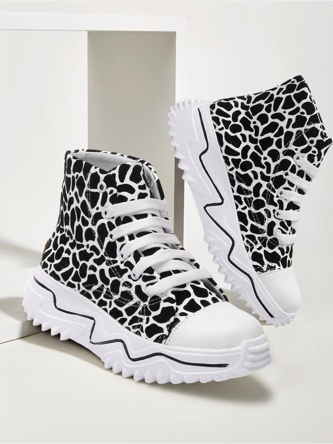 

Alishtezia Women Black & White Printed Regular Boots
