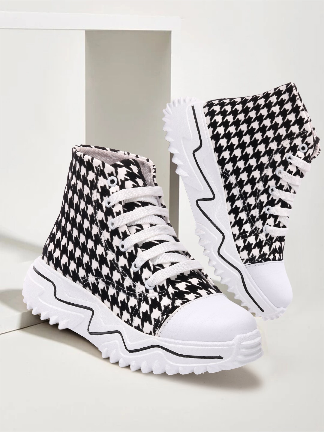 

Alishtezia Women Black Printed Ankle Boots