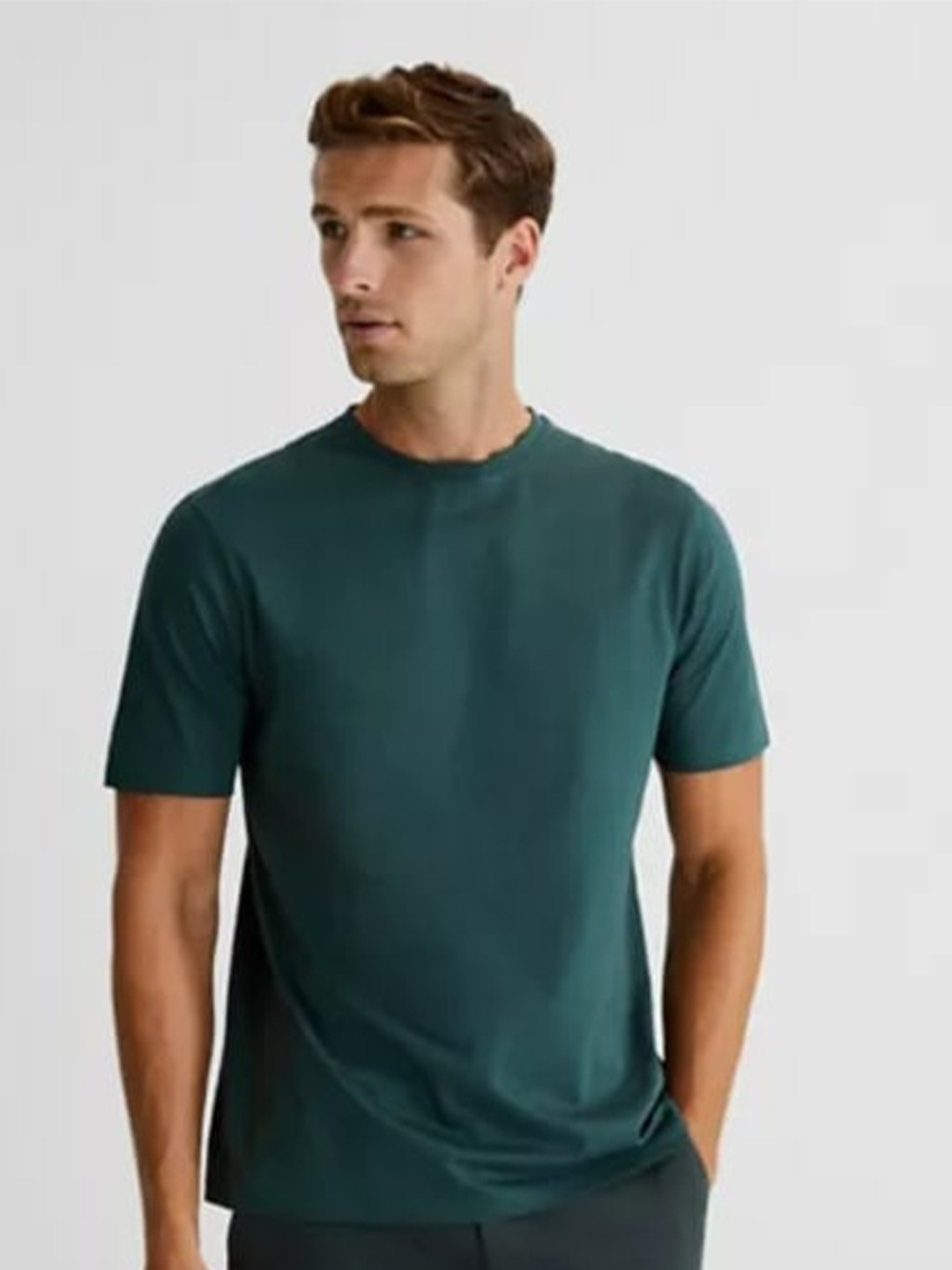 

Marks & Spencer Men Dark Green Solid Cotton T-shirt