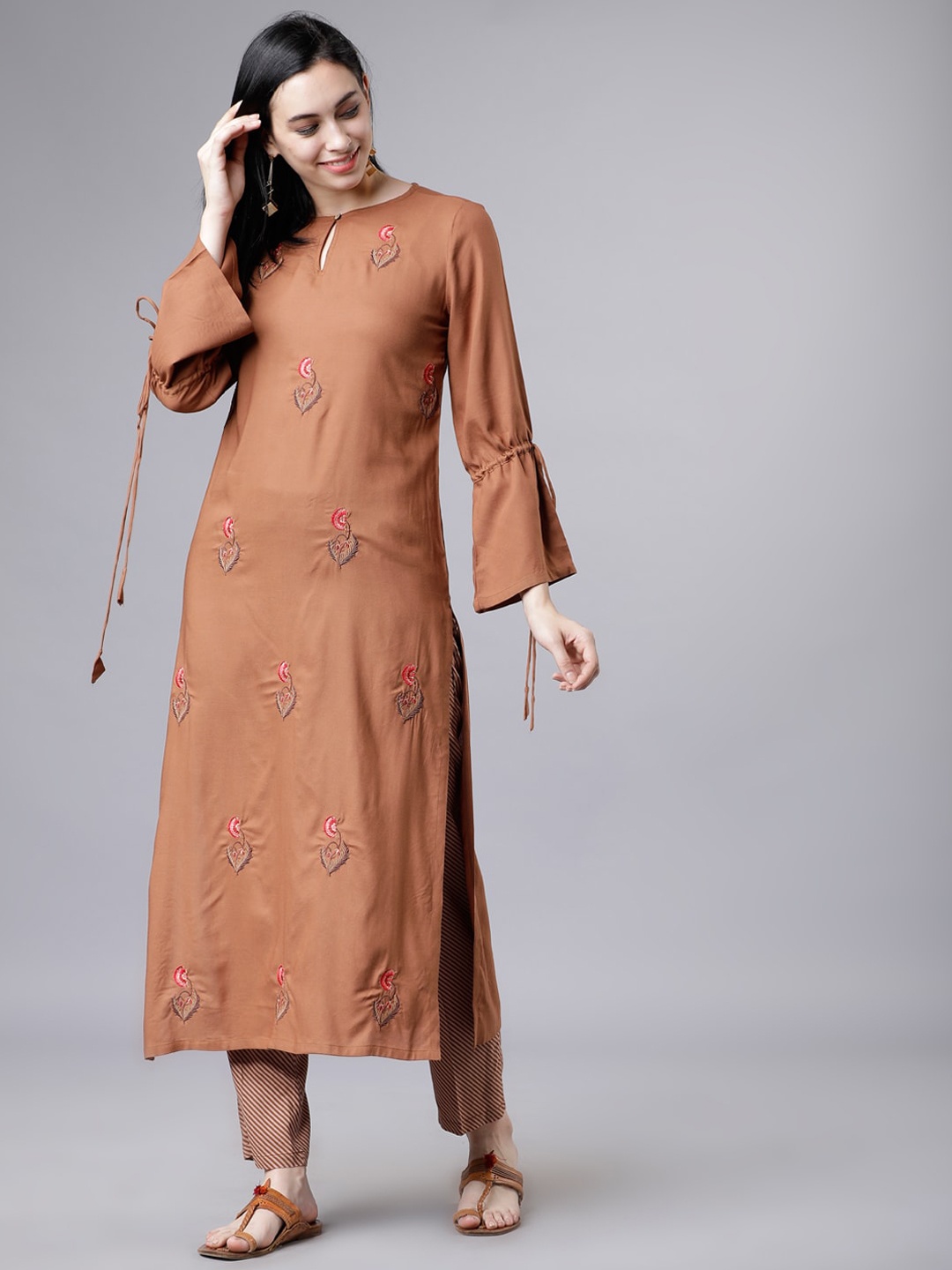 

Vishudh Women Ethnic Motifs Embroidered Kurta with Palazzos, Brown