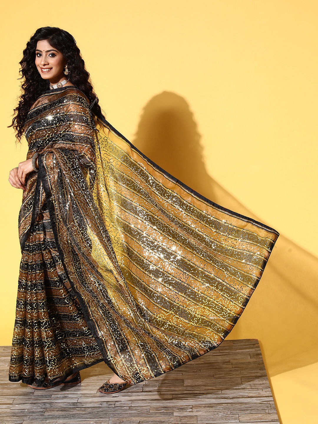 

Tikhi Imli Brown & Black Striped Sequinned Organza Saree