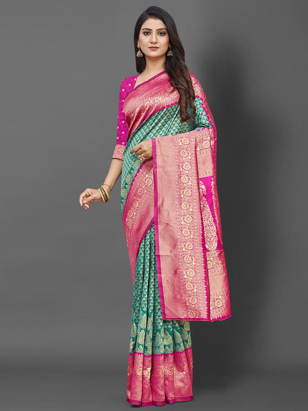 

Mitera Teal & Pink Ethnic Motifs Zari Silk Blend Banarasi Saree