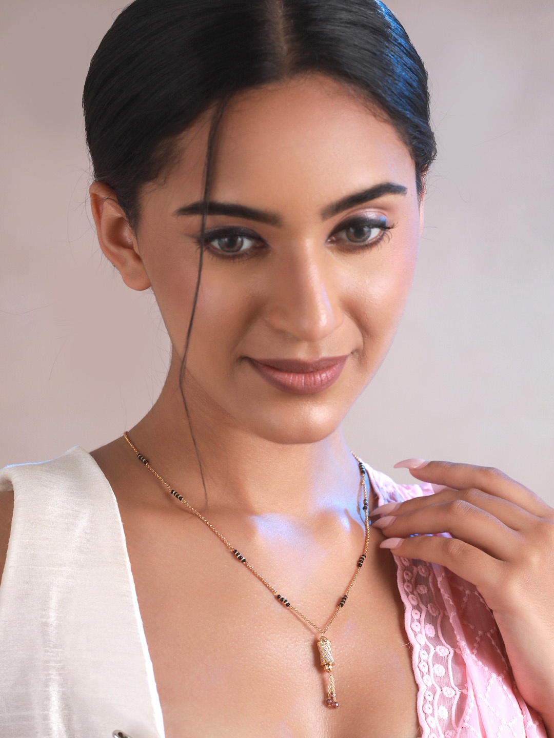 

Priyaasi Gold Plated Black Beaded White AD-Studded Mangalsutra