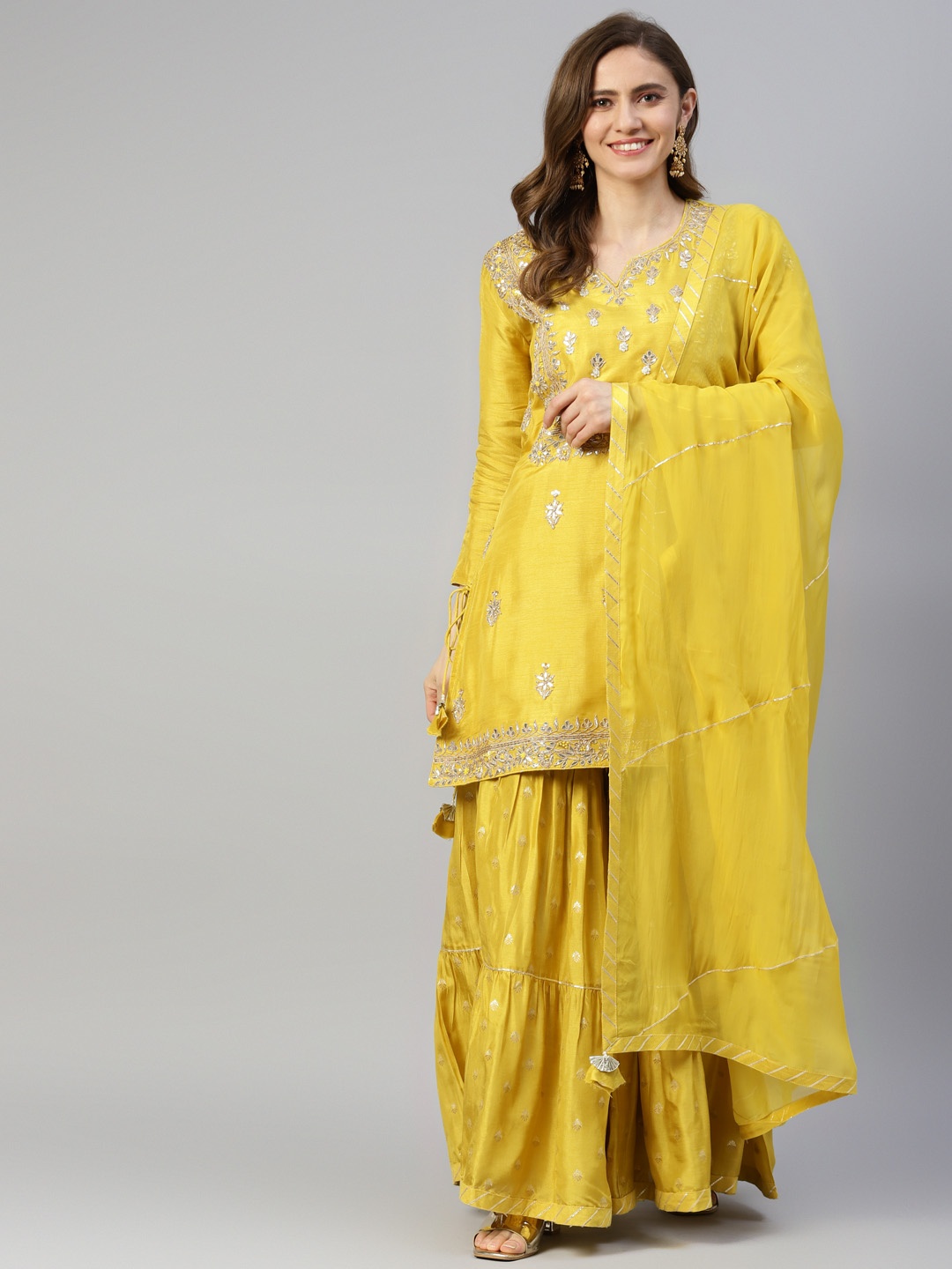 

Divena Women Yellow Embroidered Zardozi Chanderi Silk Kurta with Sharara & Dupatta