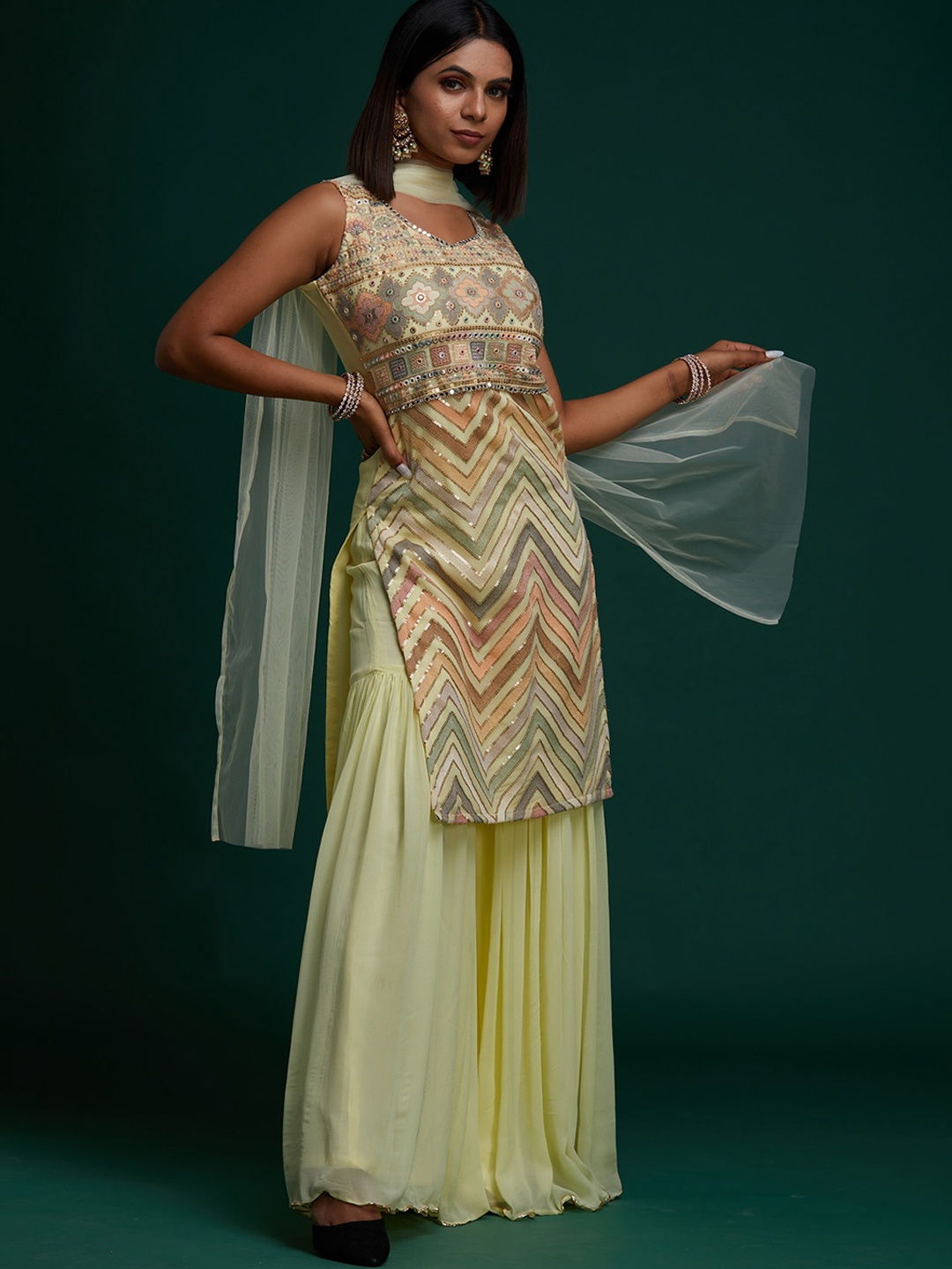 

Koskii Women Yellow Ethnic Motifs Embroidered Kurta with Sharara