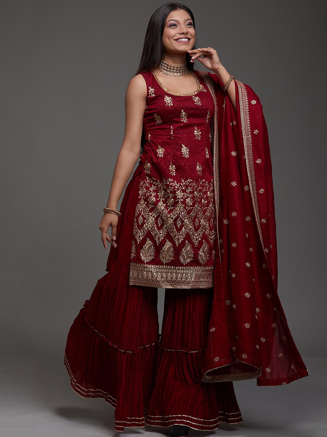 

Koskii Women Floral Embroidered Raw Silk Kurta with Sharara & Dupatta, Maroon