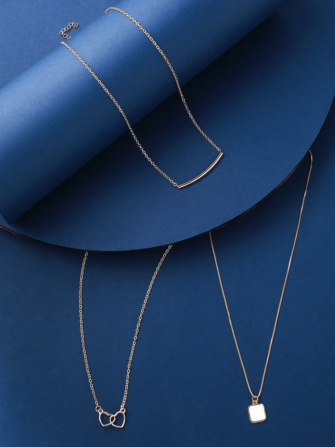 

Unwind by Yellow Chimes Set Of 3 Gold-Toned White Crystal Studded Pendant With Chain