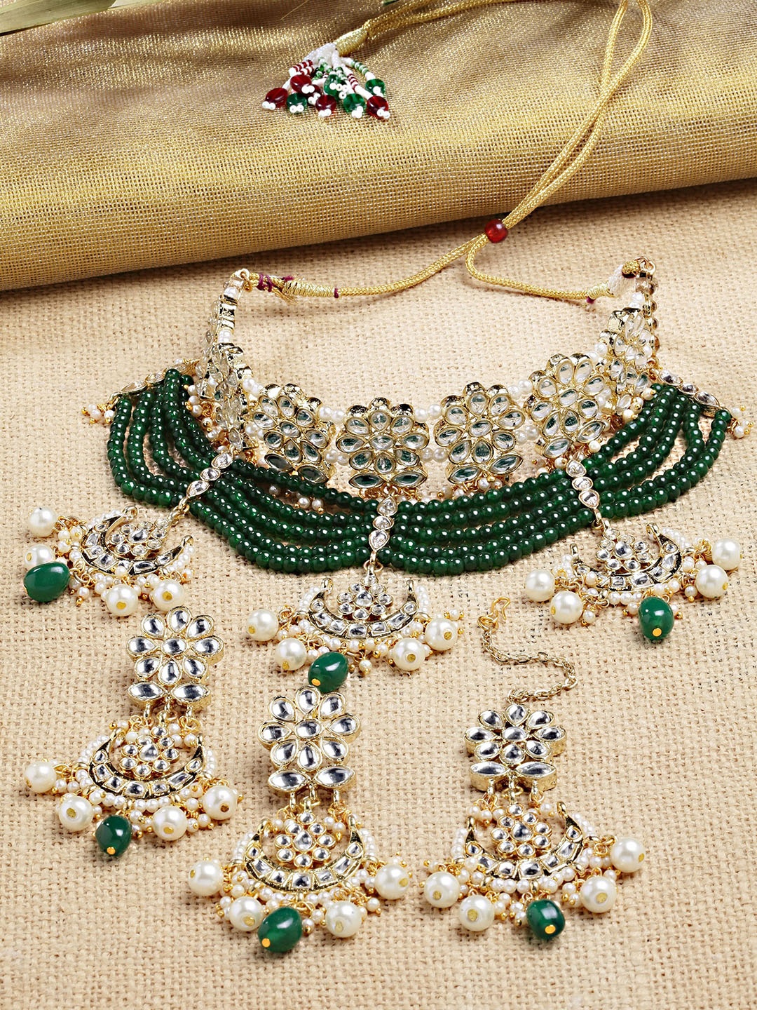 

KARATCART Gold-Plated Green & White Kundan Studded & Beaded Handcrafted Jewellery Set