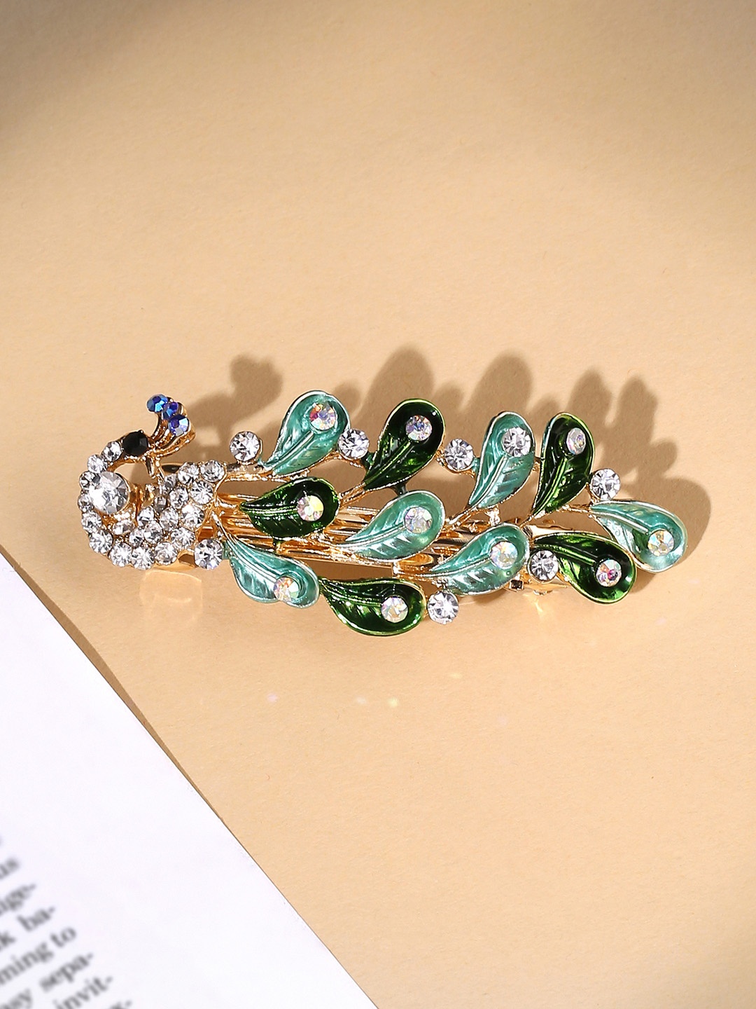 

Yellow Chimes Green Peacock Designed White Crystal Studded French Baratte Hair Clip