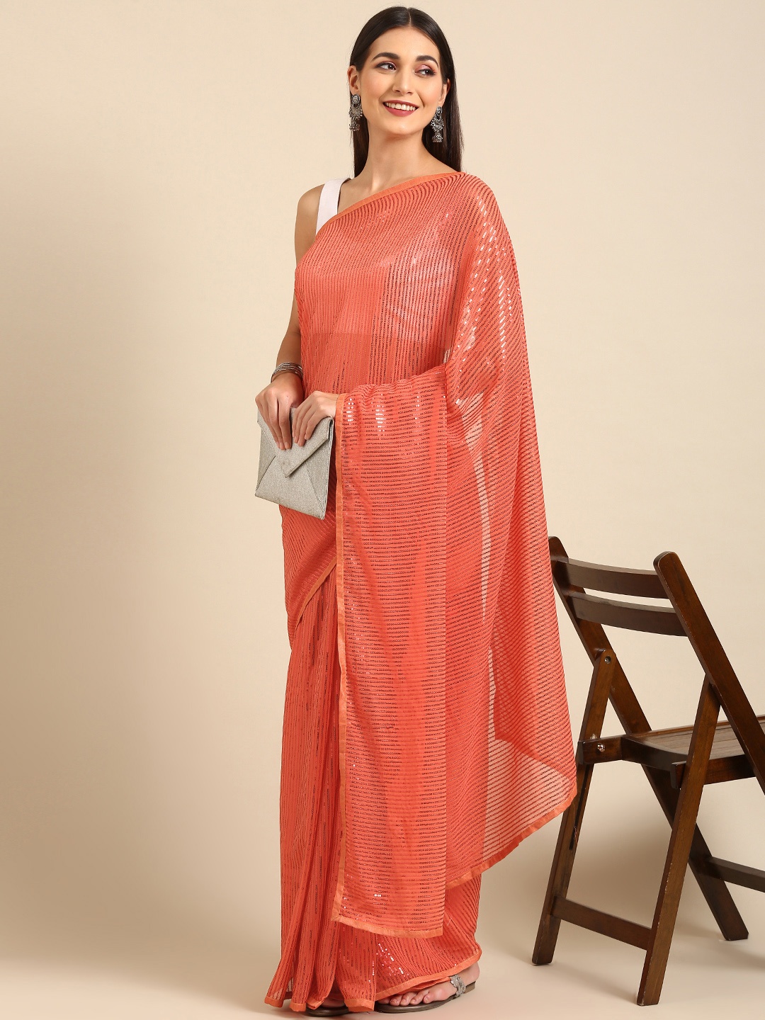 

Pothys Woman Embellished Sequinned Pure Chiffon Saree, Orange