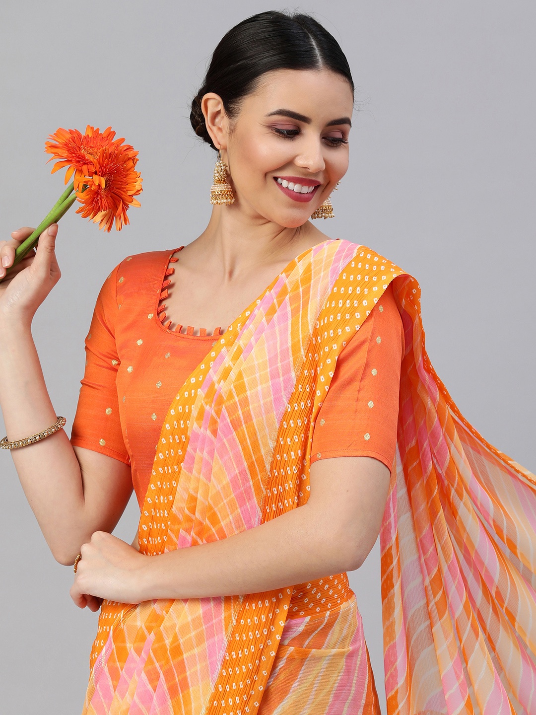 

Satrani Orange & Pink Leheriya Saree