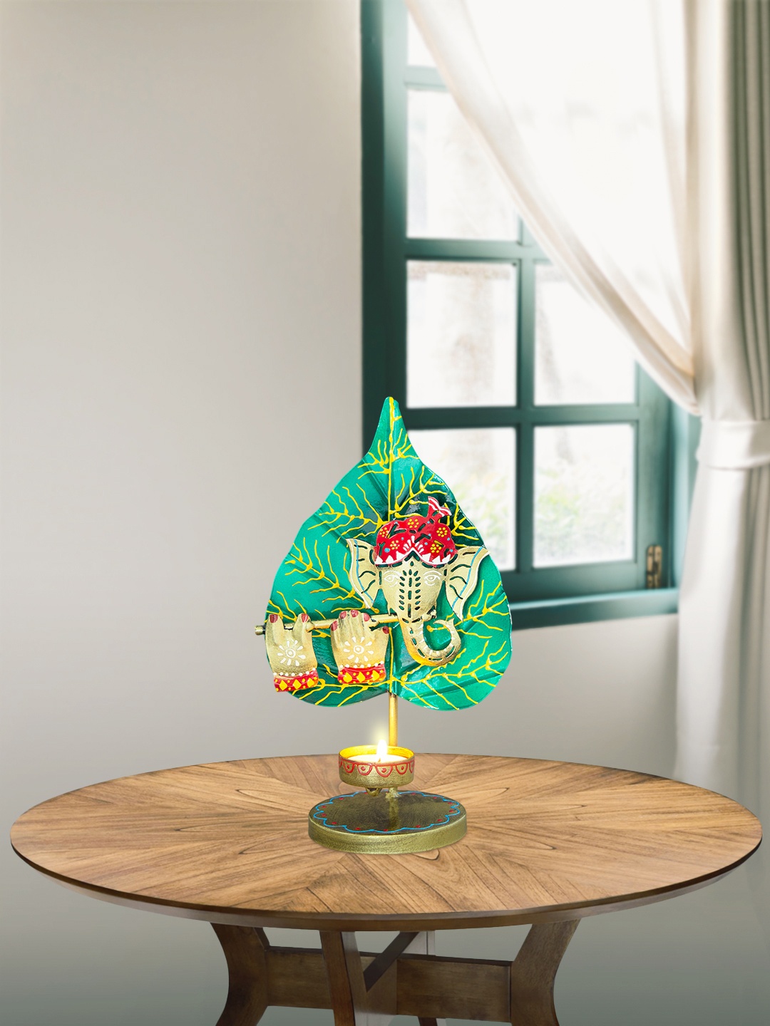 

Golden Peacock Gold-Toned Green T-light Ganesh Candle Holder