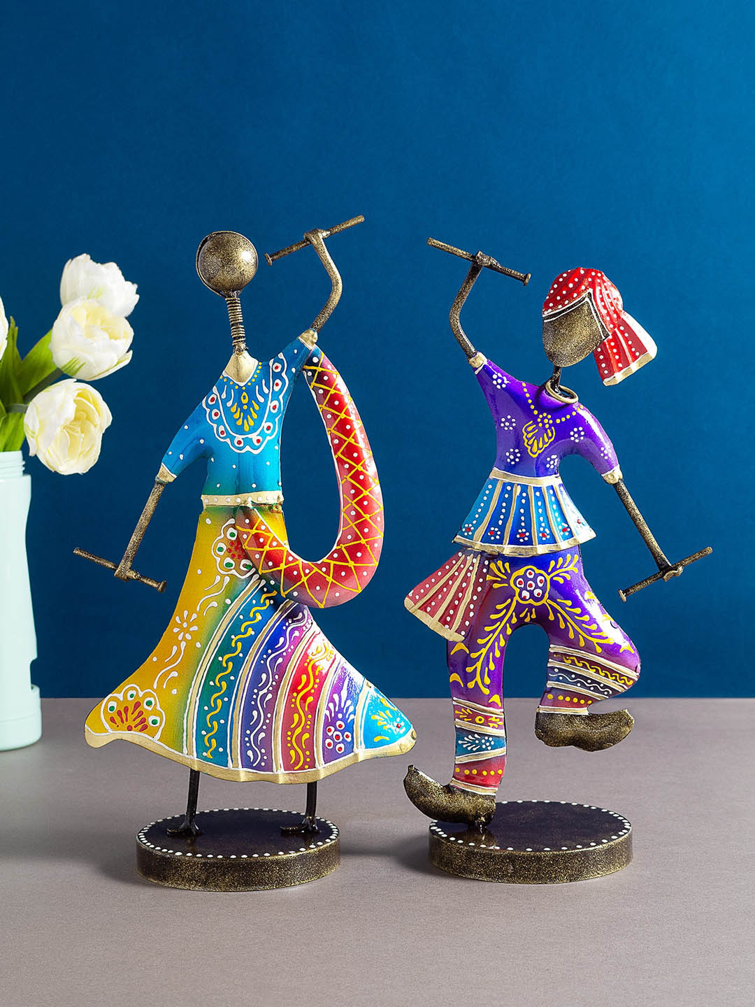 

Golden Peacock Set Of 2 Gold-toned & Blue Couple Playing Dandia Garba Showpieces