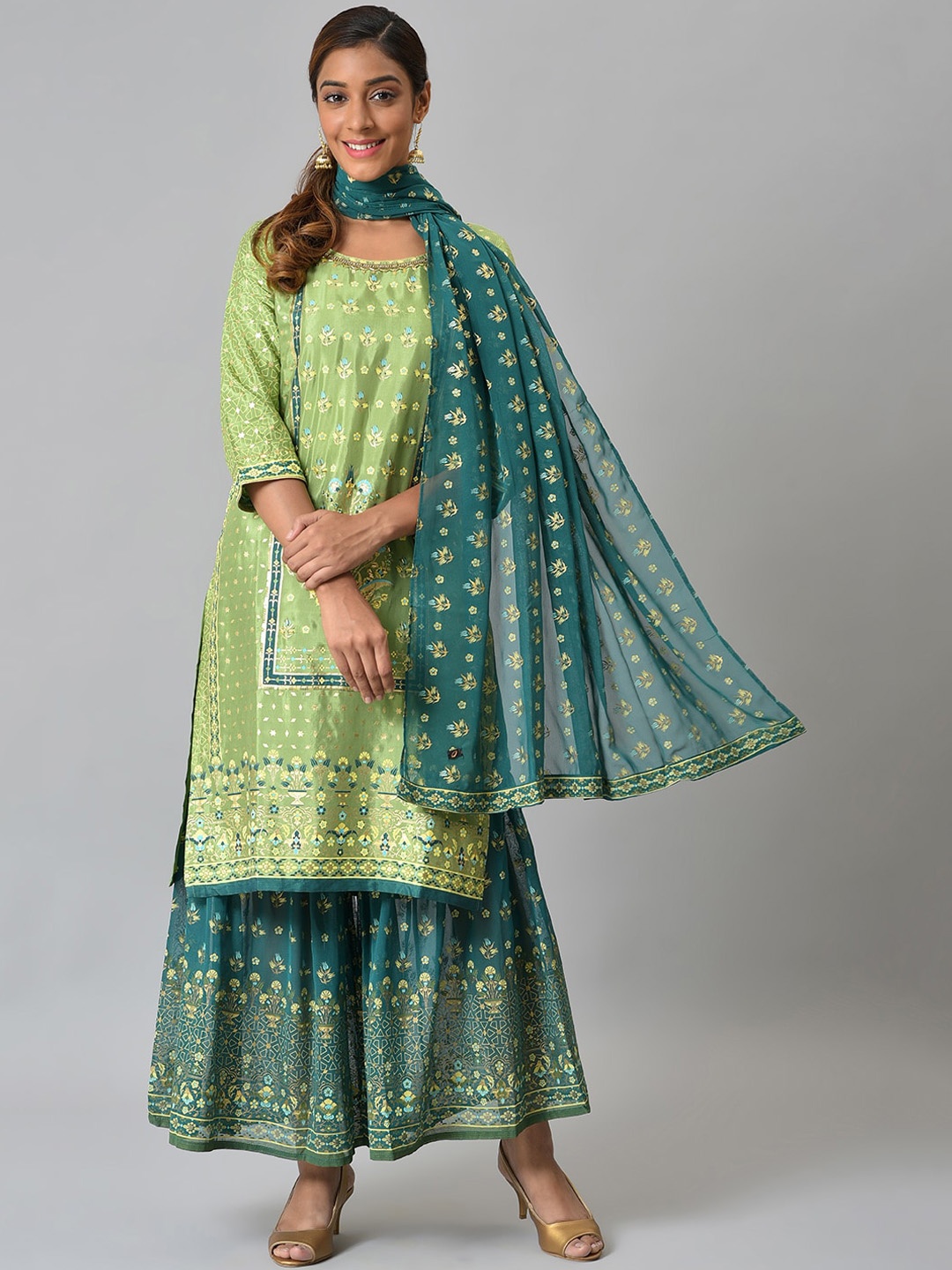 

Aurelia Women Green Foil Printed Liva Kurta with Sharara and Dupatta