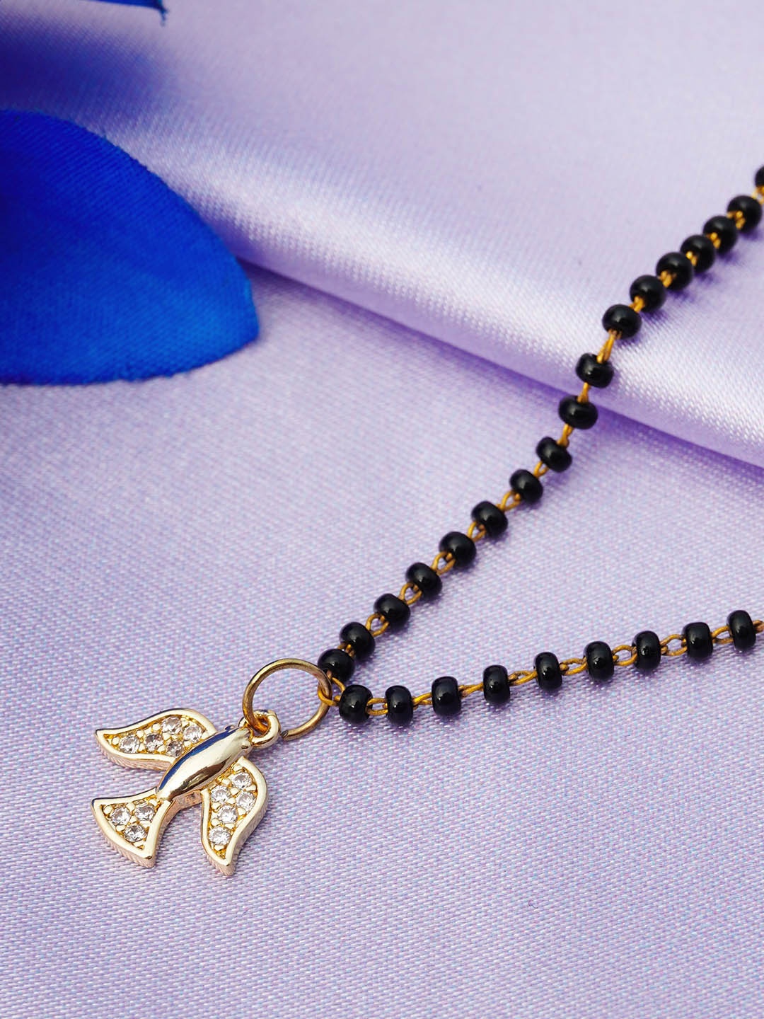 

Ferosh Black And Gold Toned Gold Plated Bird Pendant Stone-Studded Beaded Mangalsutra