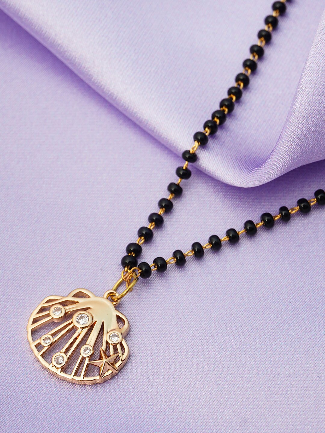 

Ferosh Black And Gold Toned Gold Plated Crystal Seashell Pendant Beaded Mangalsutra