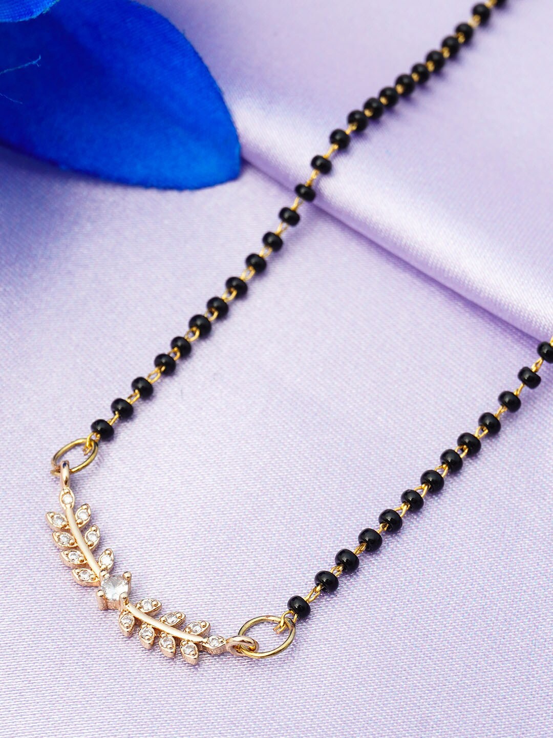 

Ferosh Black And Gold Toned Gold Plated Leafy Vine Pendant Beaded Mangalsutra