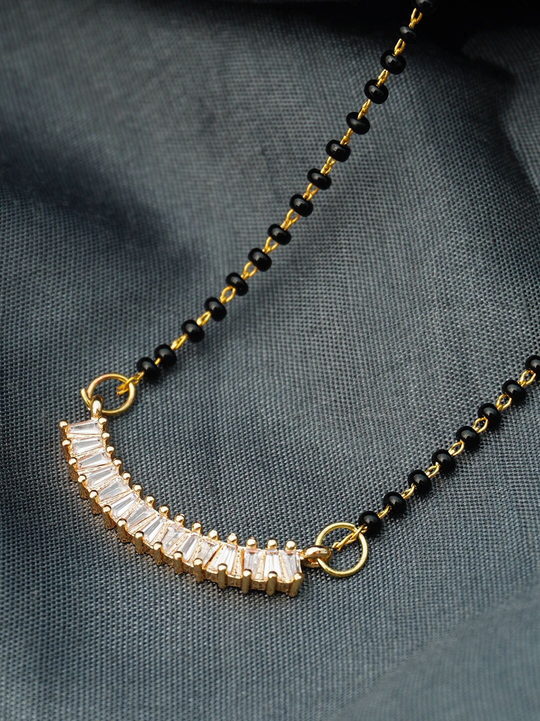 

Ferosh Black & Gold Toned Gold Plated Strip Pendant Stone-Studded Beaded Mangalsutra