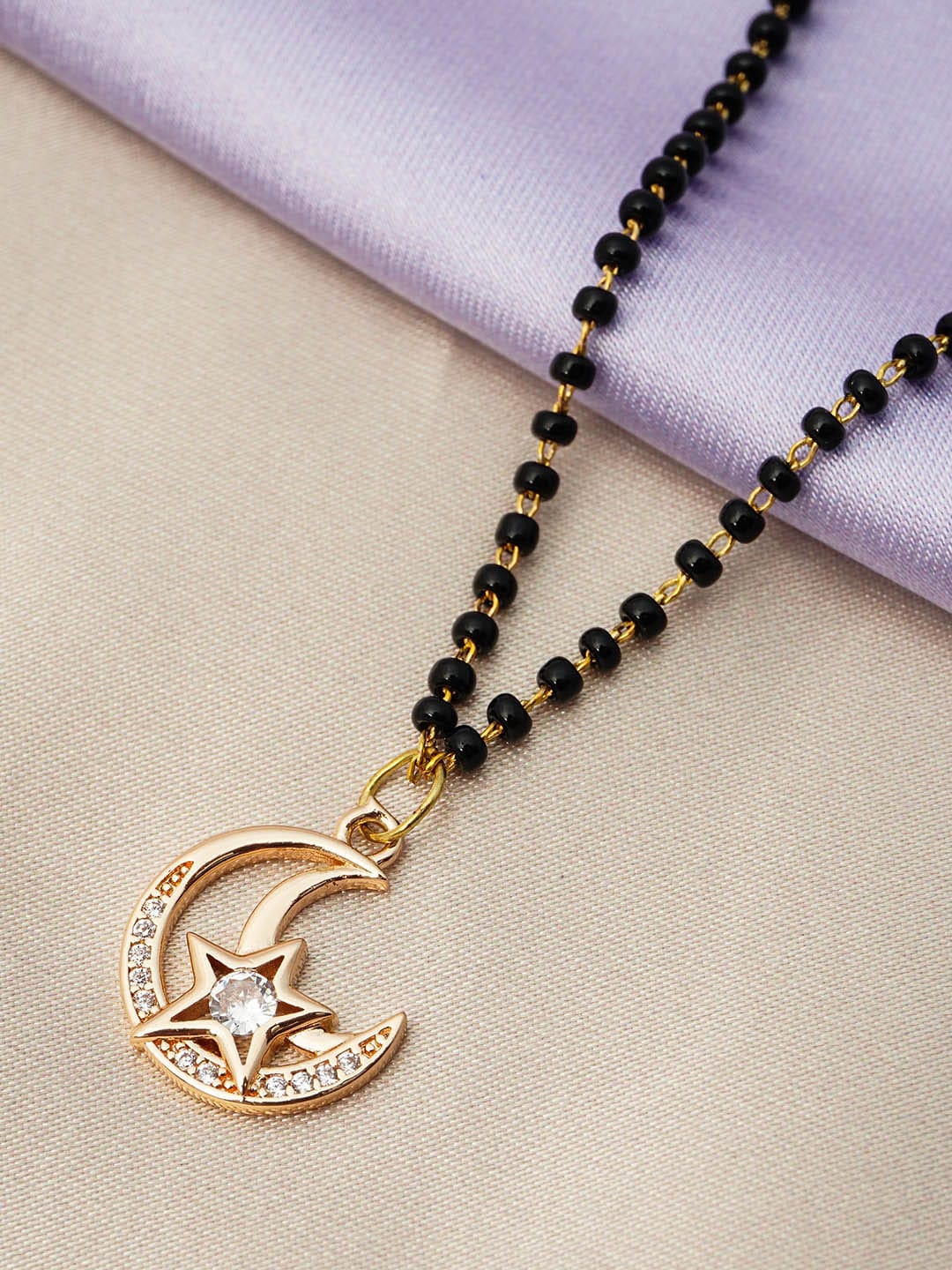 

Ferosh Black And Gold Toned Gold-Plated Star Moon Pendant Beaded Mangalsutra