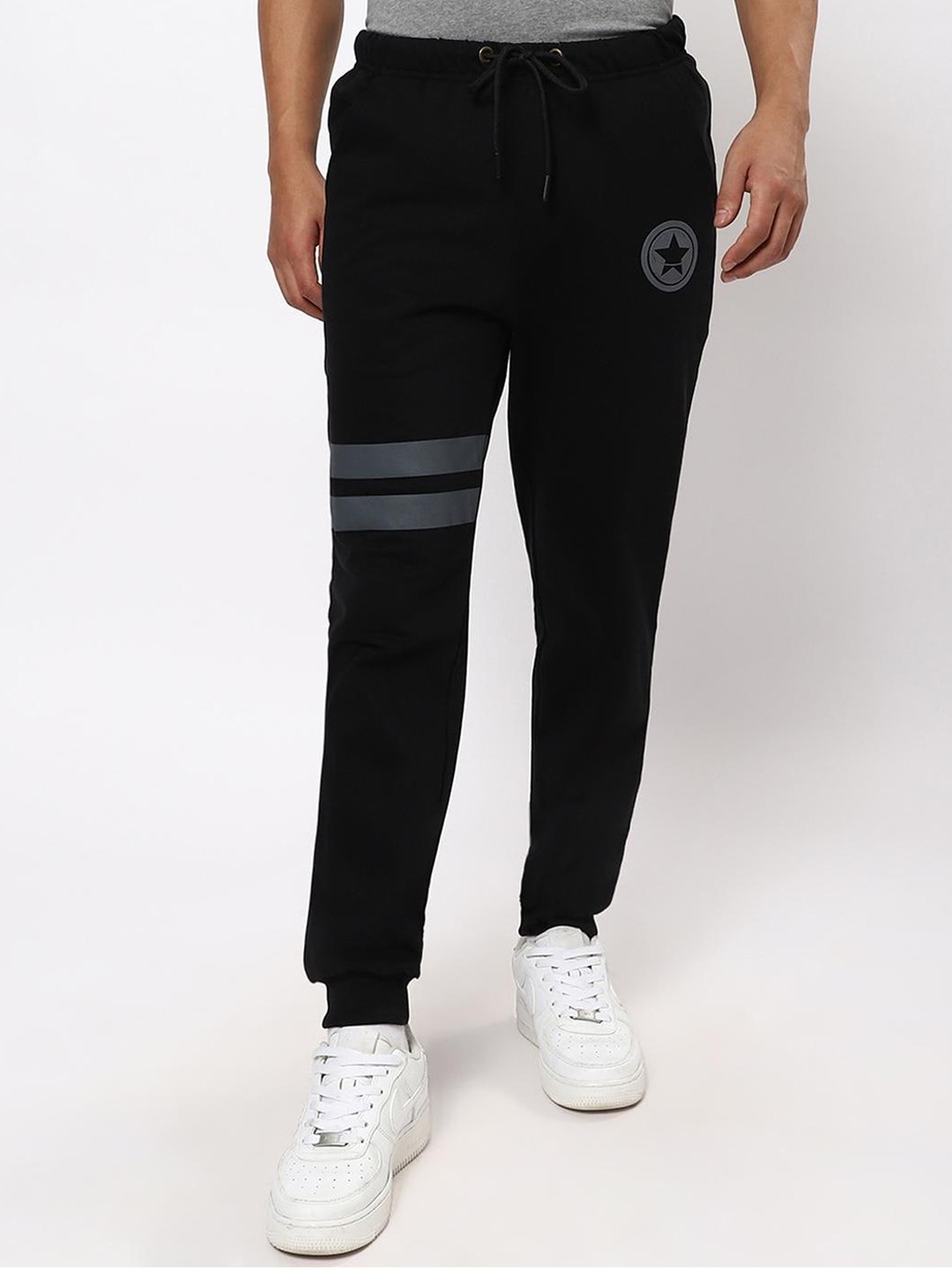 

Bewakoof Men Black Striped Printed Joggers