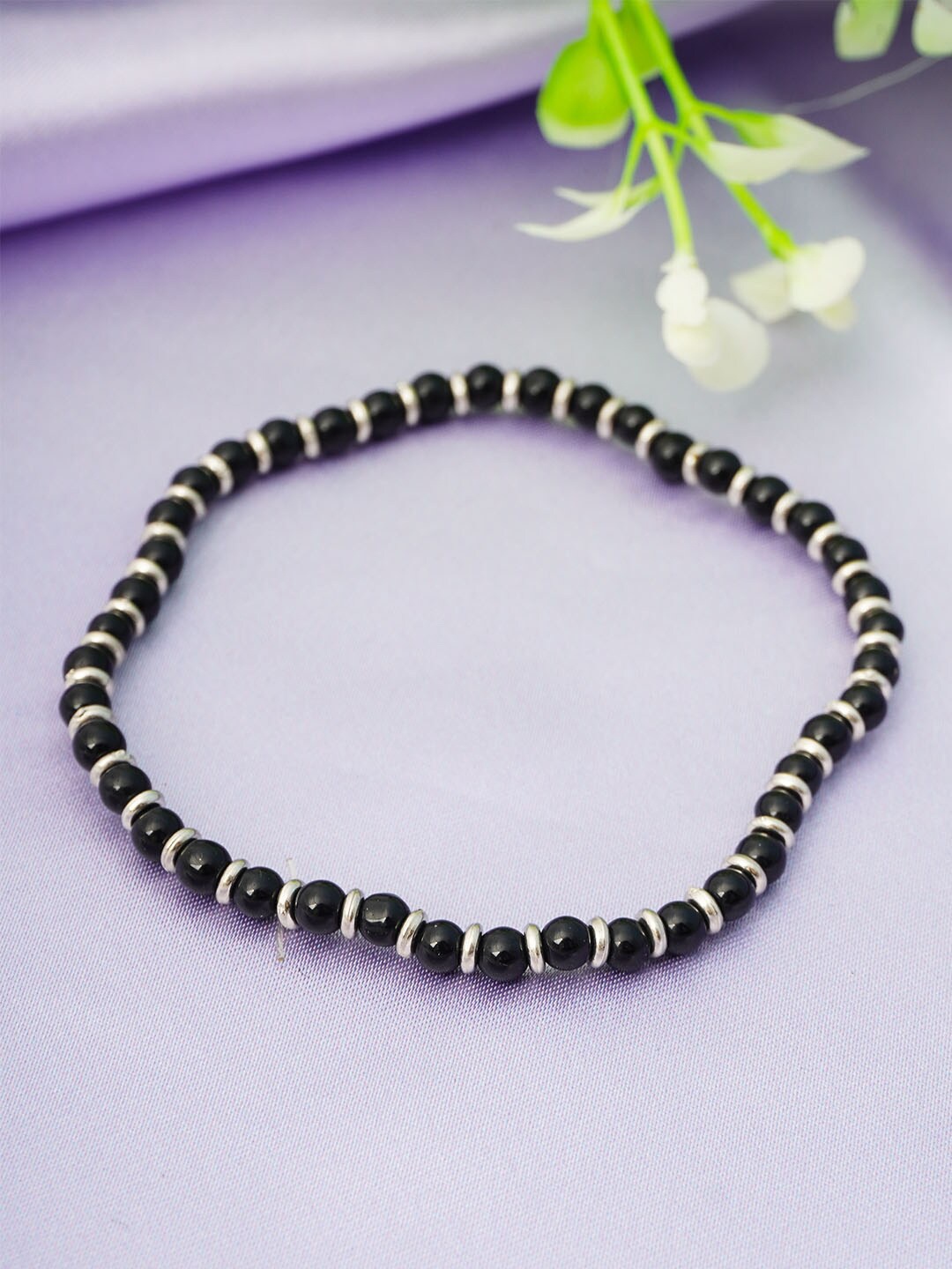 

Urmika Women Silver-Toned Black Beaded Anklet