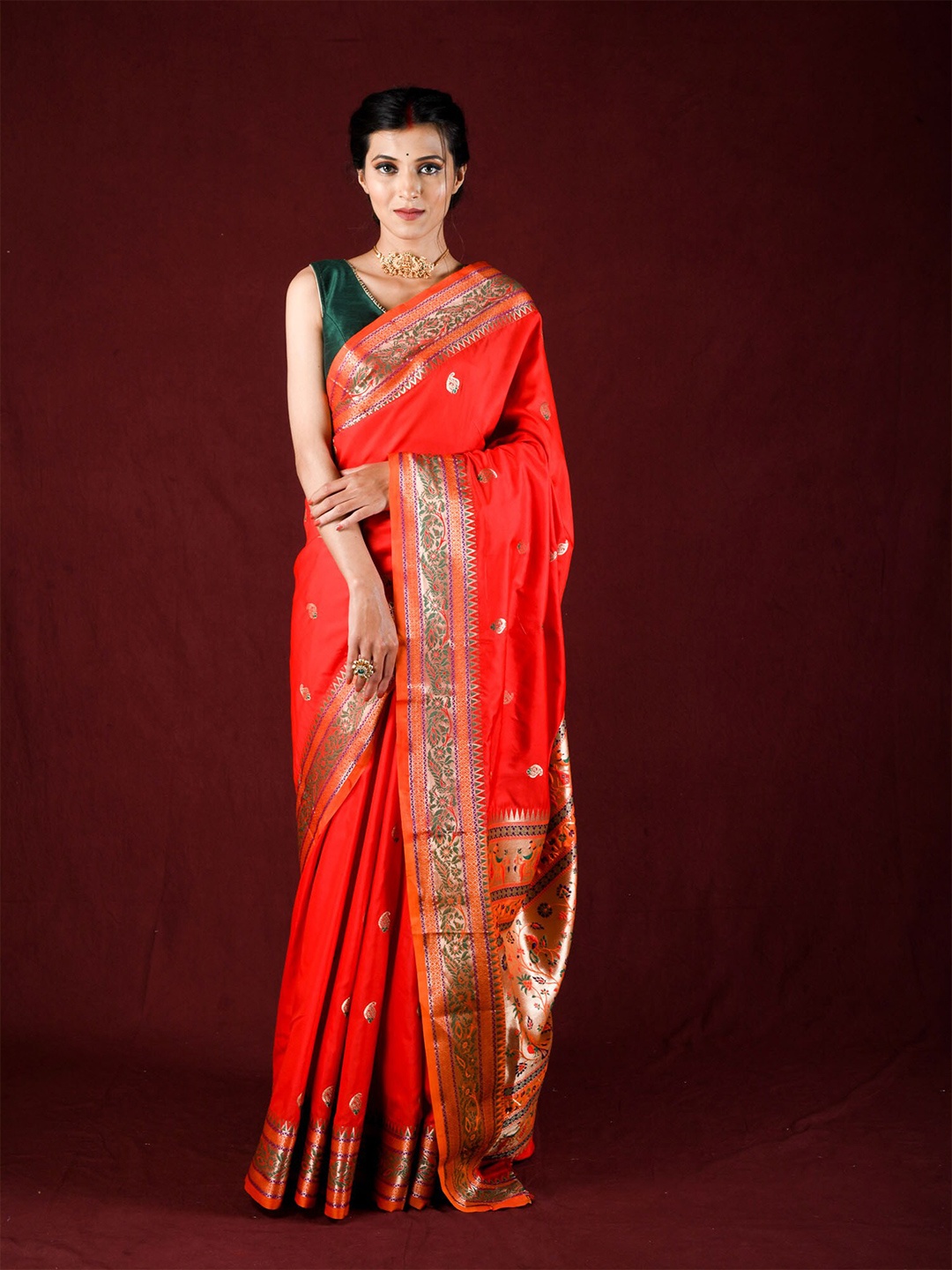

Exclusiva Orange & Green Woven Design Zari Silk Blend Saree