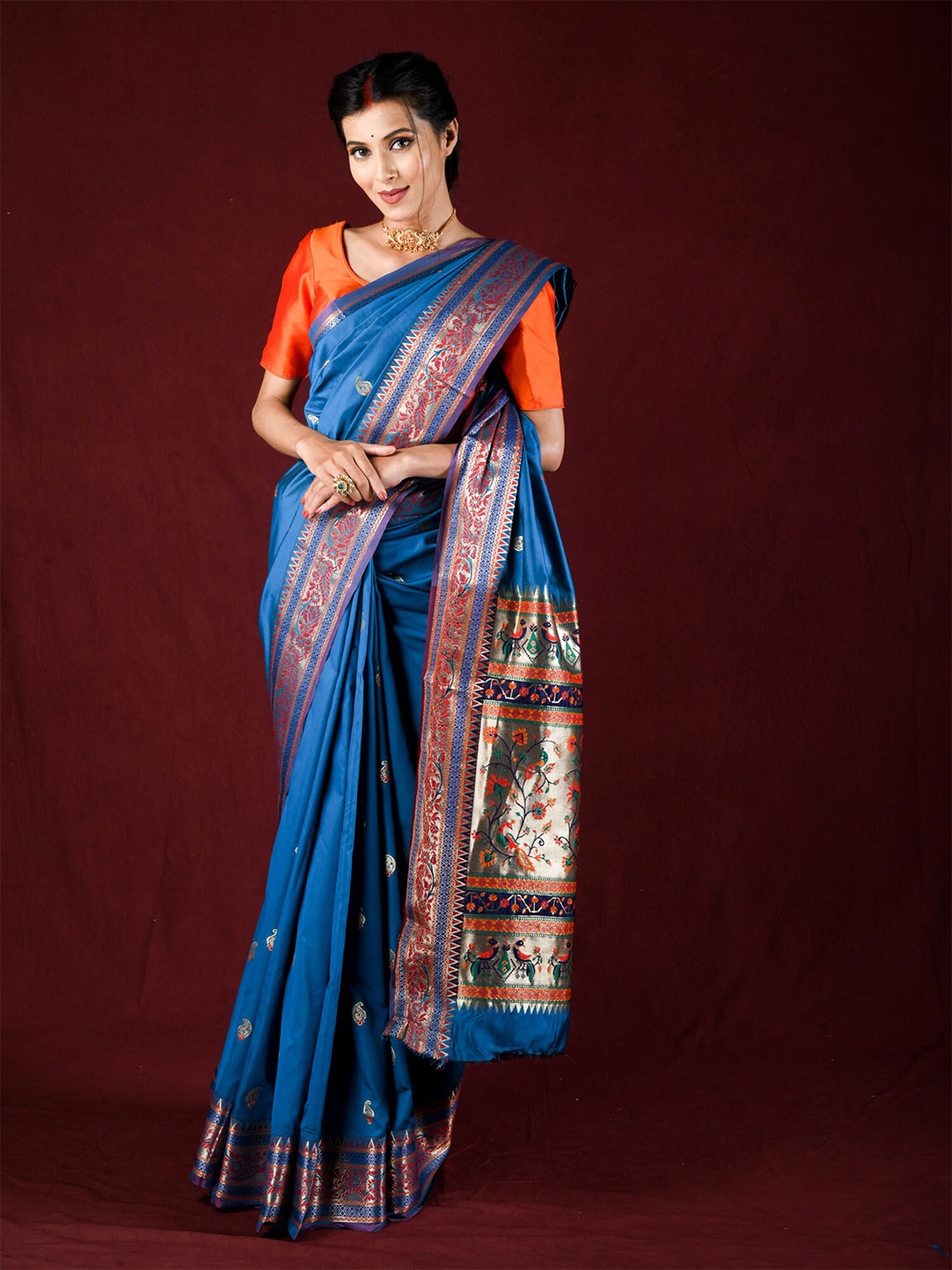 

Exclusiva Blue & Orange Woven Design Zari Silk Blend Saree