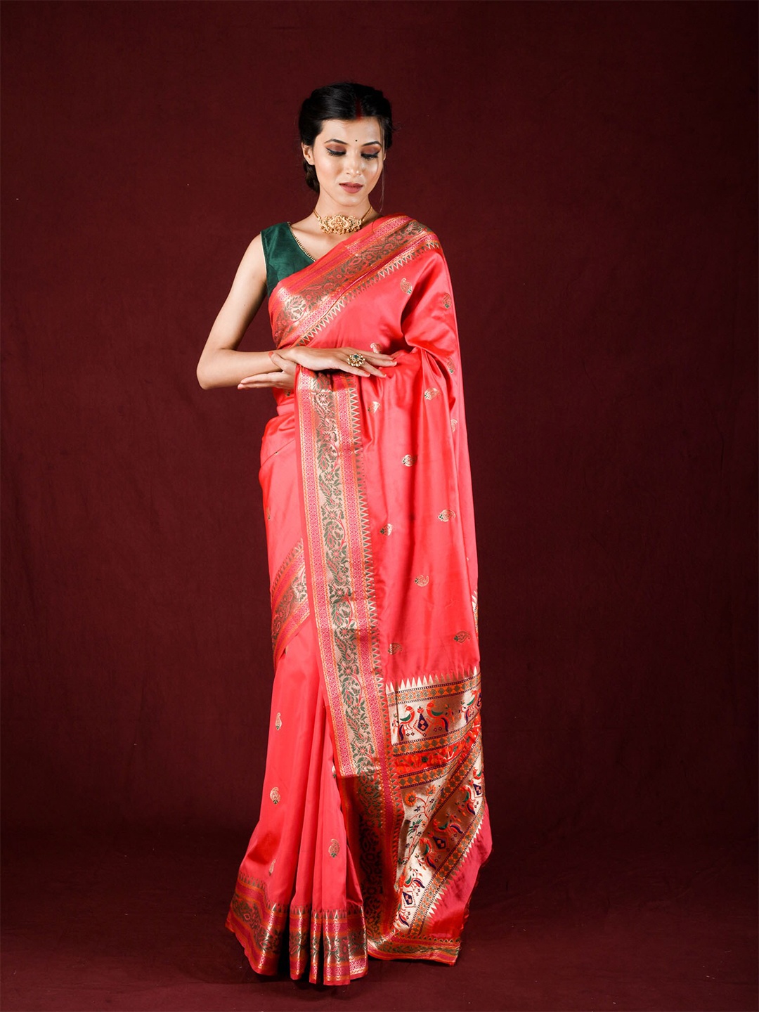 

Exclusiva Pink & Green Woven Design Zari Silk Blend Saree