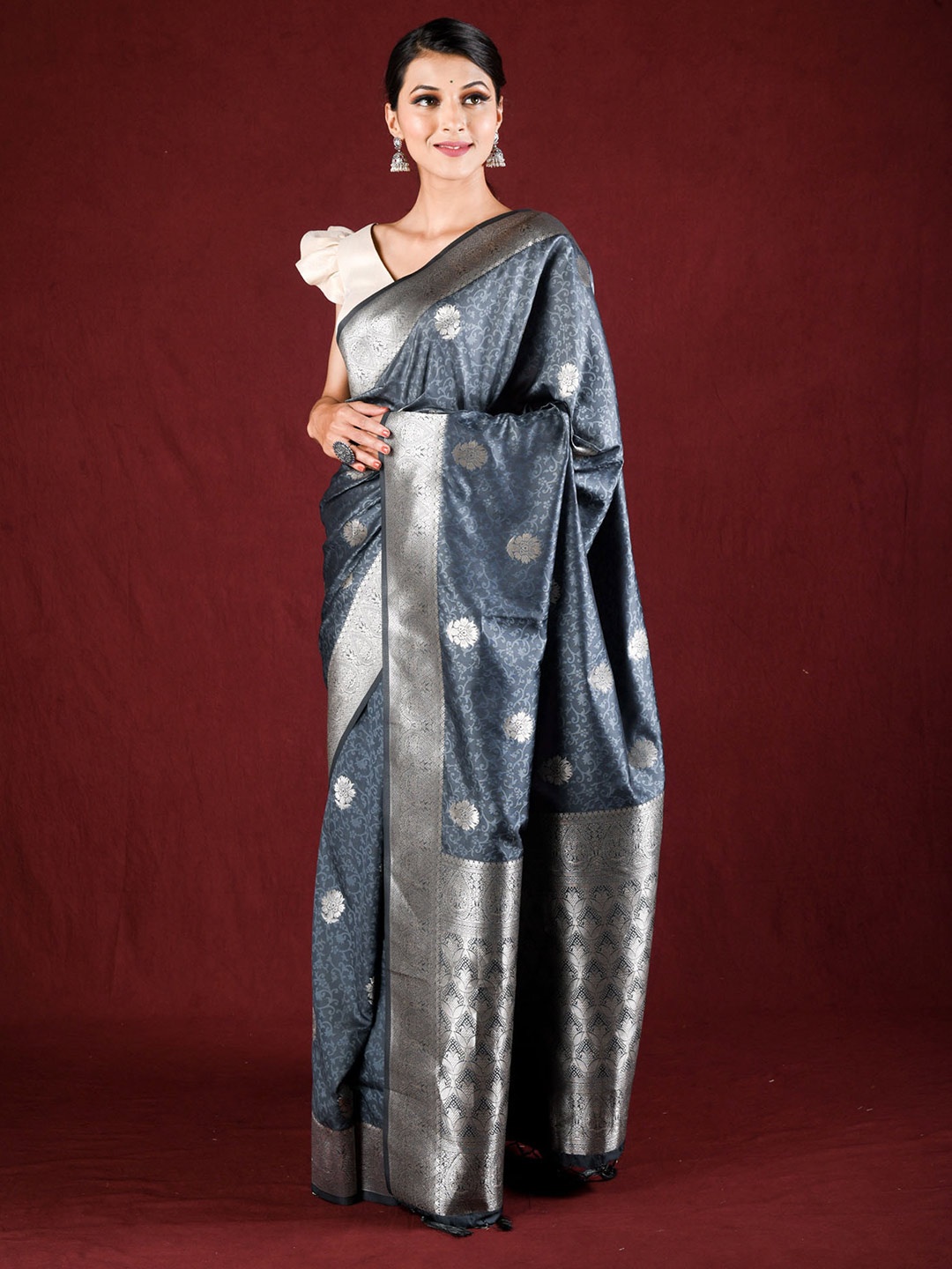 

Exclusiva Grey & Silver-Toned Ethnic Motifs Zari Saree