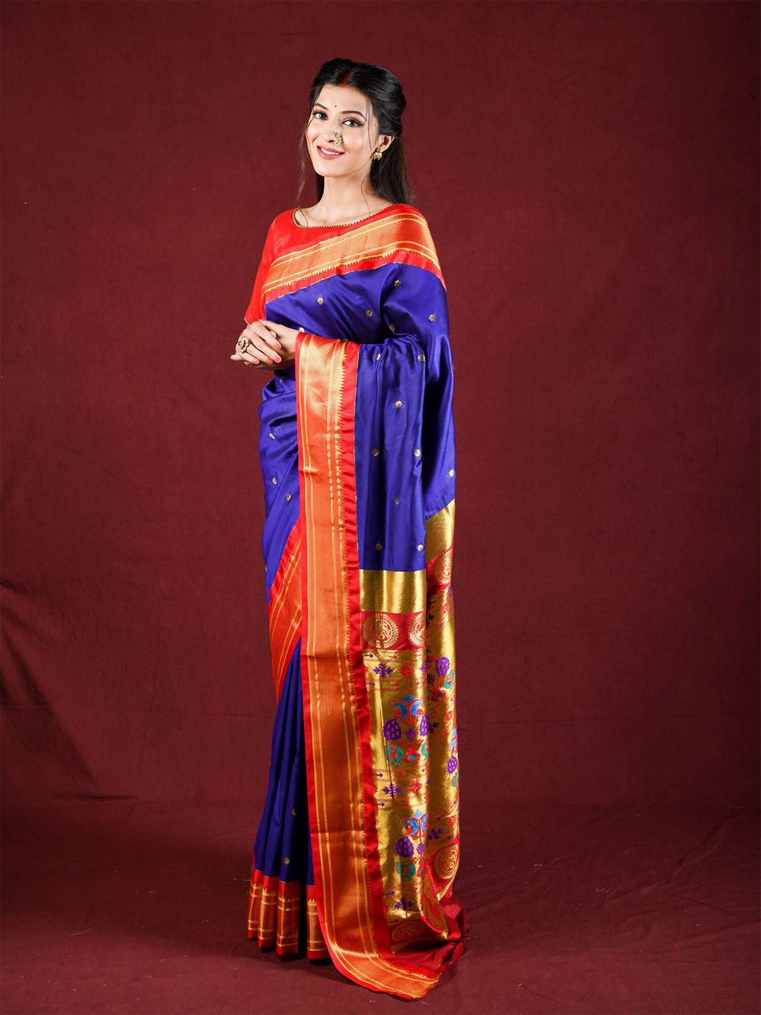 

Exclusiva Blue & Red Ethnic Motifs Zari Paithani Saree