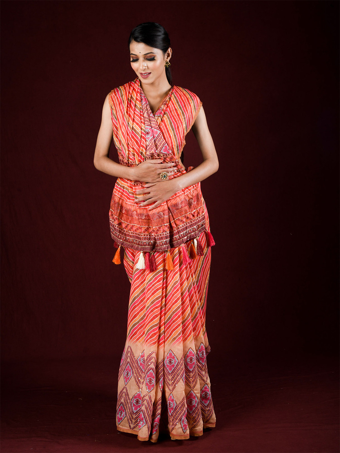 

Exclusiva Red & Pink Leheriya Print & Sequined Silk Cotton Saree