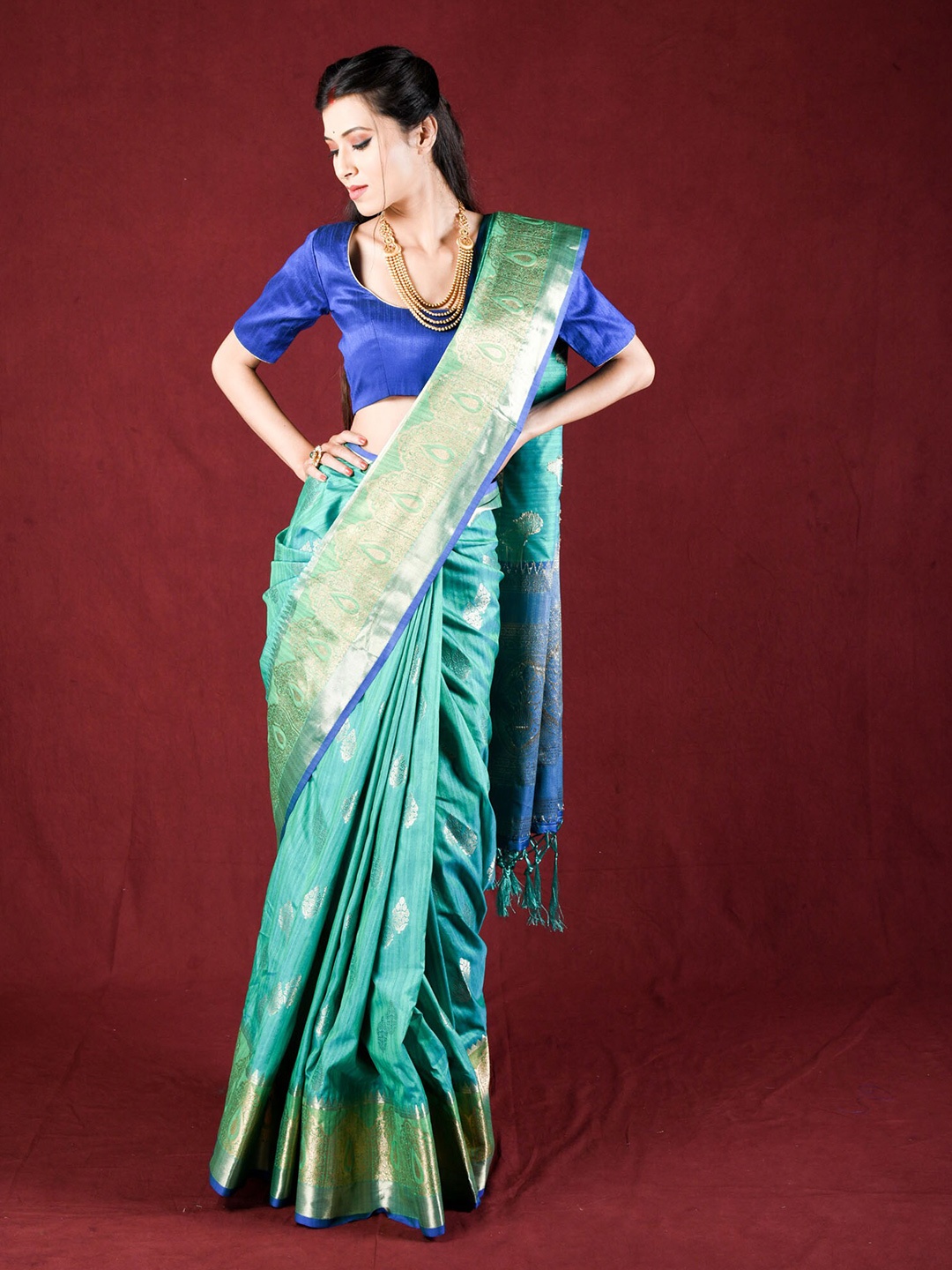 

Exclusiva Green & Blue Woven Design Zari Silk Blend Saree