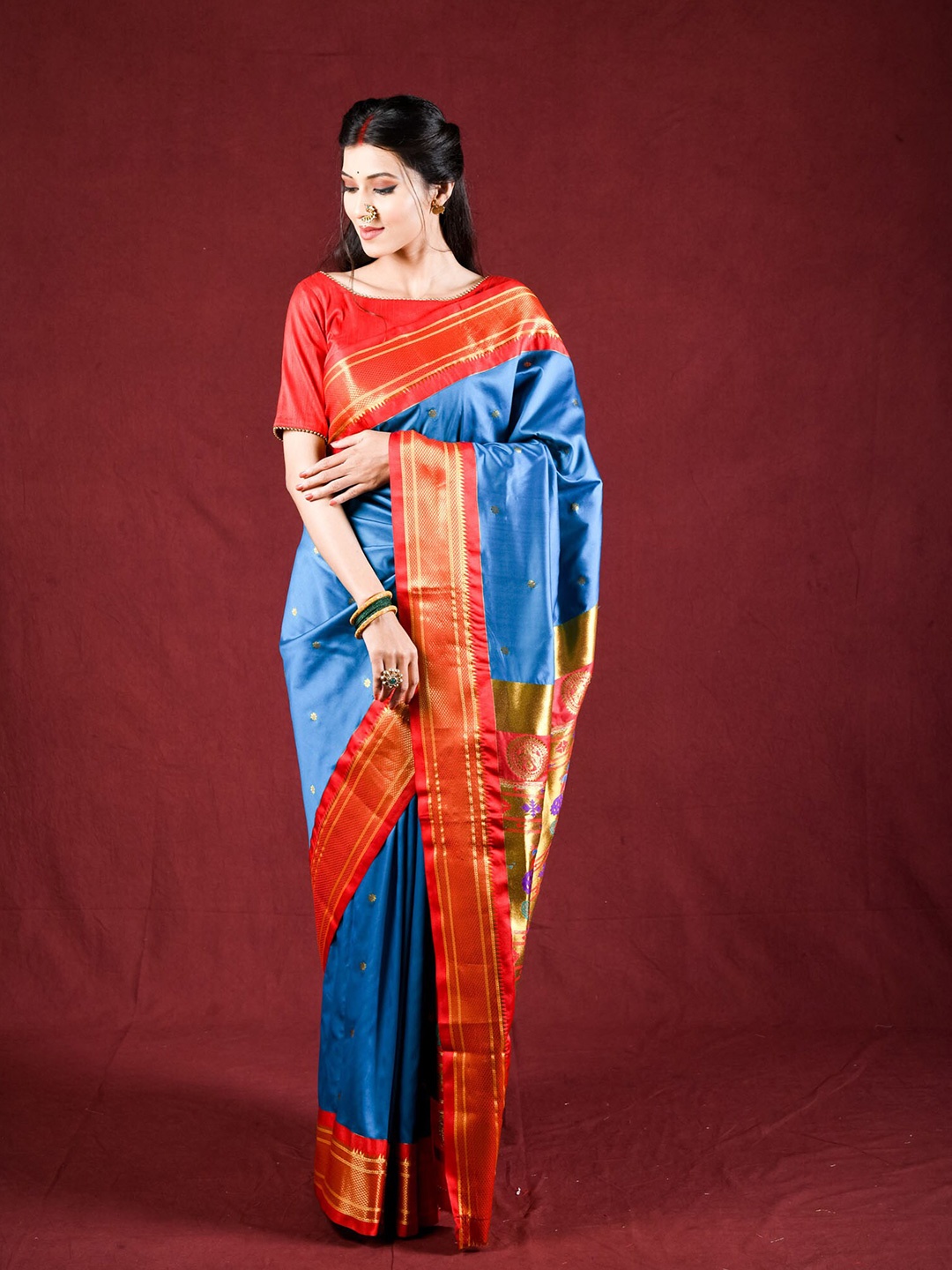 

Exclusiva Blue & Red Woven Design Zari Silk Blend Paithani Saree