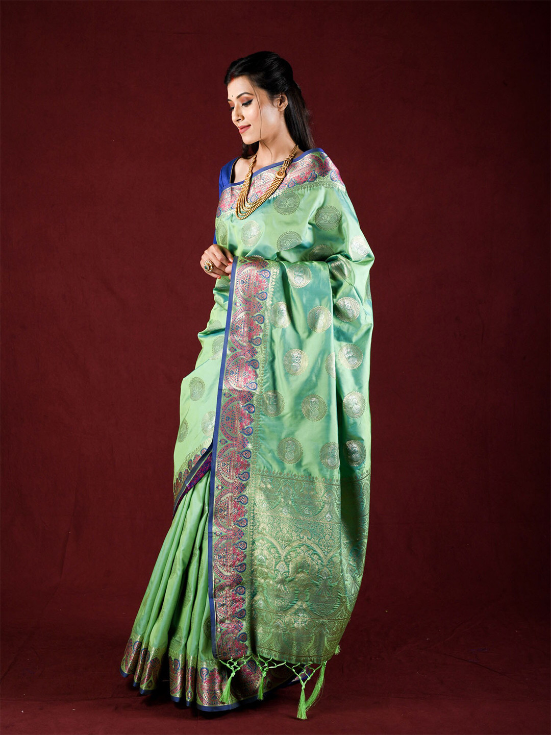 

Exclusiva Green & Blue Woven Design Zari Silk Blend Saree