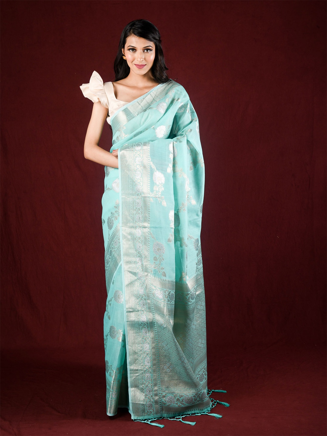 

Exclusiva Blue & Silver-Toned Ethnic Motifs Zari Linen Blend Saree