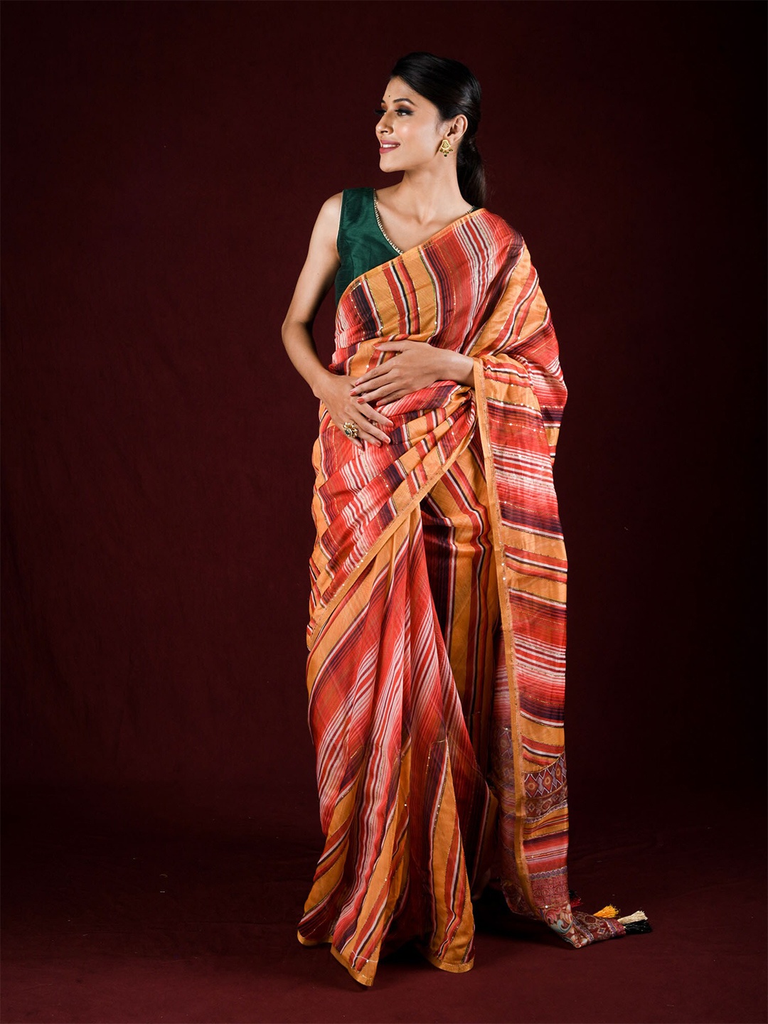 

Exclusiva Red & Orange Striped Sequinned Silk Cotton Saree