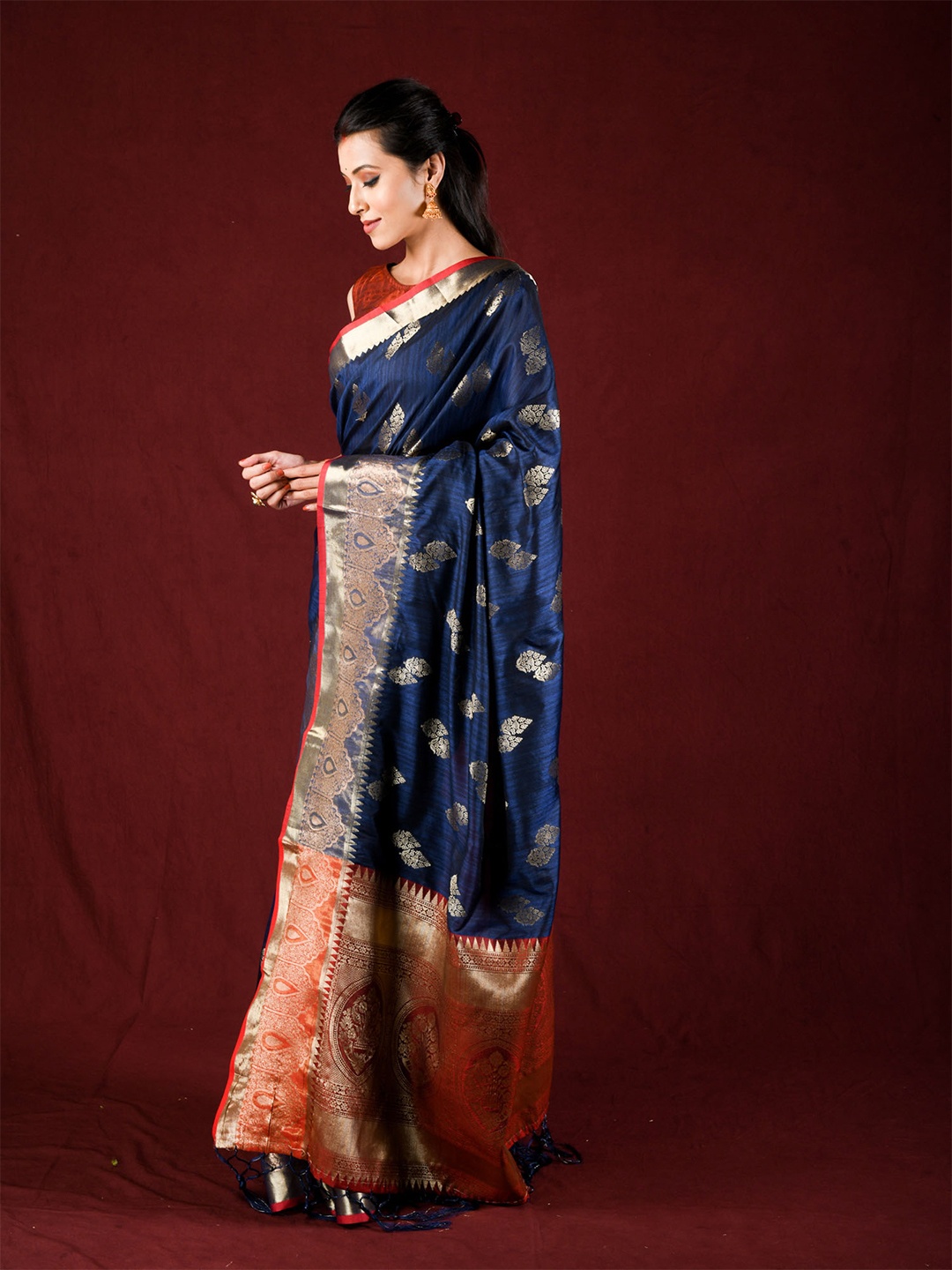 

Exclusiva Blue & Orange Ethnic Motifs Zari Silk Blend Saree