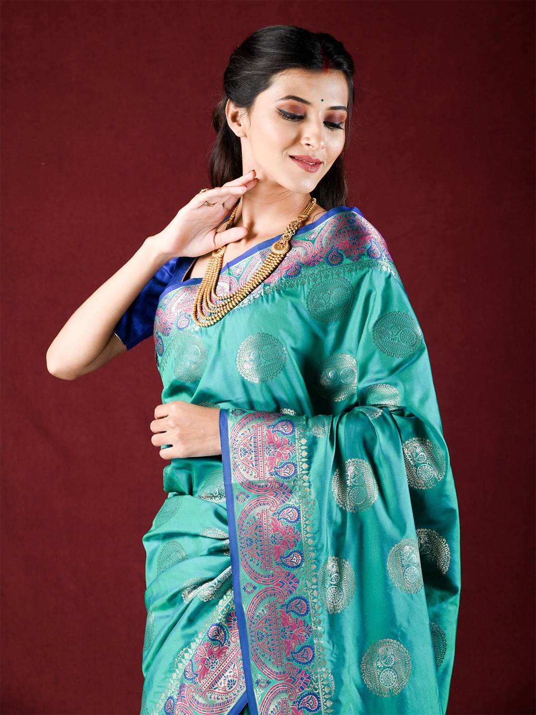 

Exclusiva Women Green & Blue Woven Design Zari Silk Blend Saree
